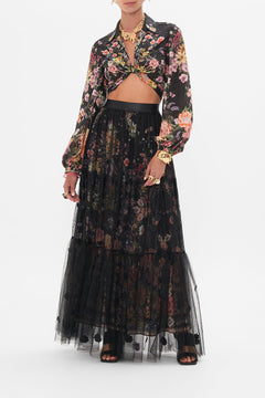 Front view of model wearing CAMILLA ruffle skirt in Letters From A Vineyard print