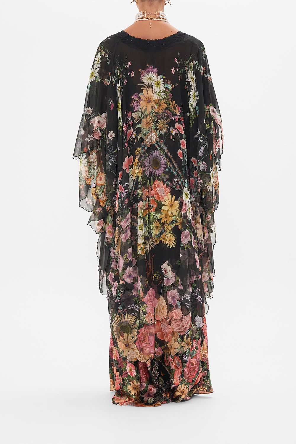 Back view of model wearing CAMILLA silk layer in Letters From A Vineyard print