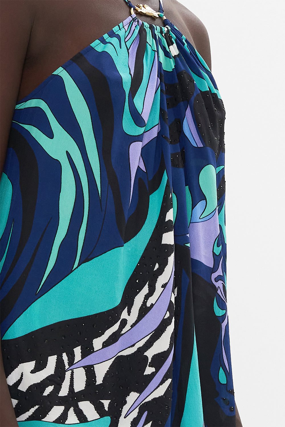 Detail view of model wearing CAMILLA silk halter top in Vividly Venice print