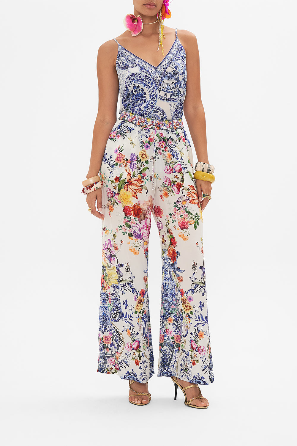 Front view of model wearing CAMILLA silk pants in Dutch Is Life print