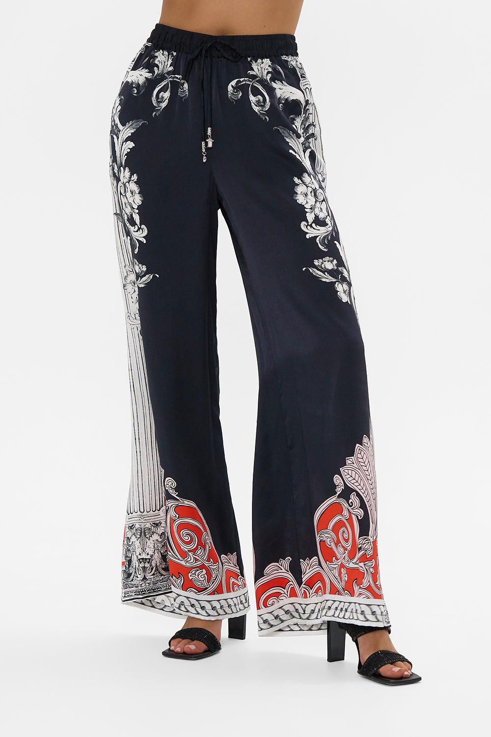 The CAMILLA METAL EYELET KAFTAN ROCOCO GLOW in our  print.