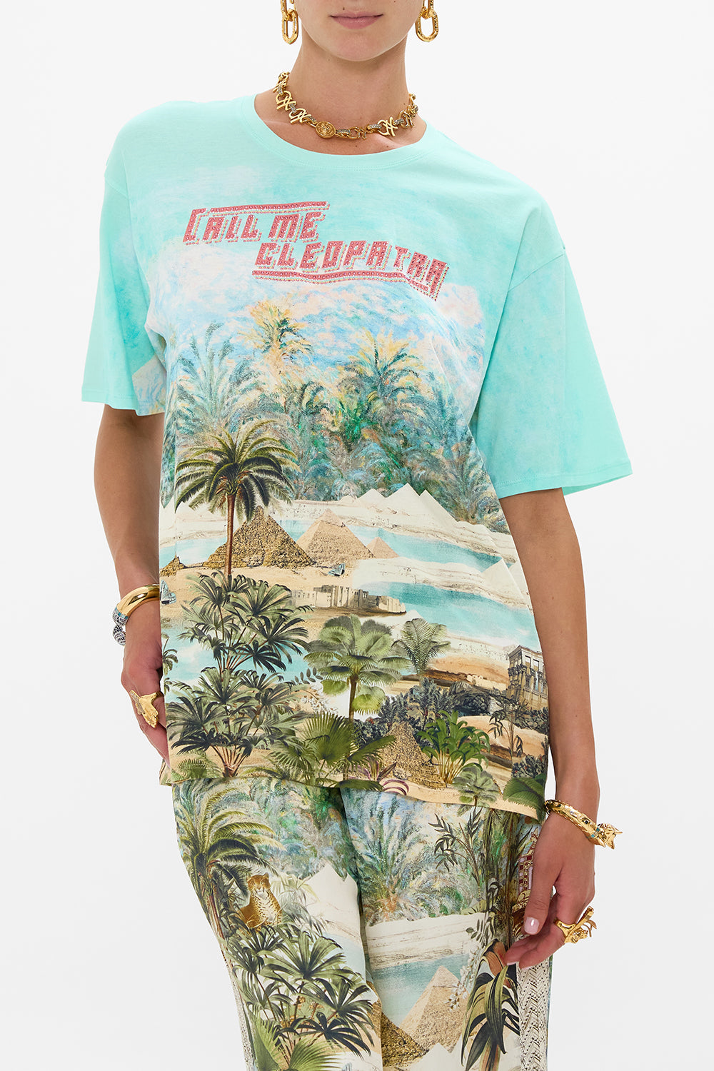 The CAMILLA STRAPLESS JUMPSUIT WITH D RING BELT DANCING WITH DAYLIGHT in our  print.