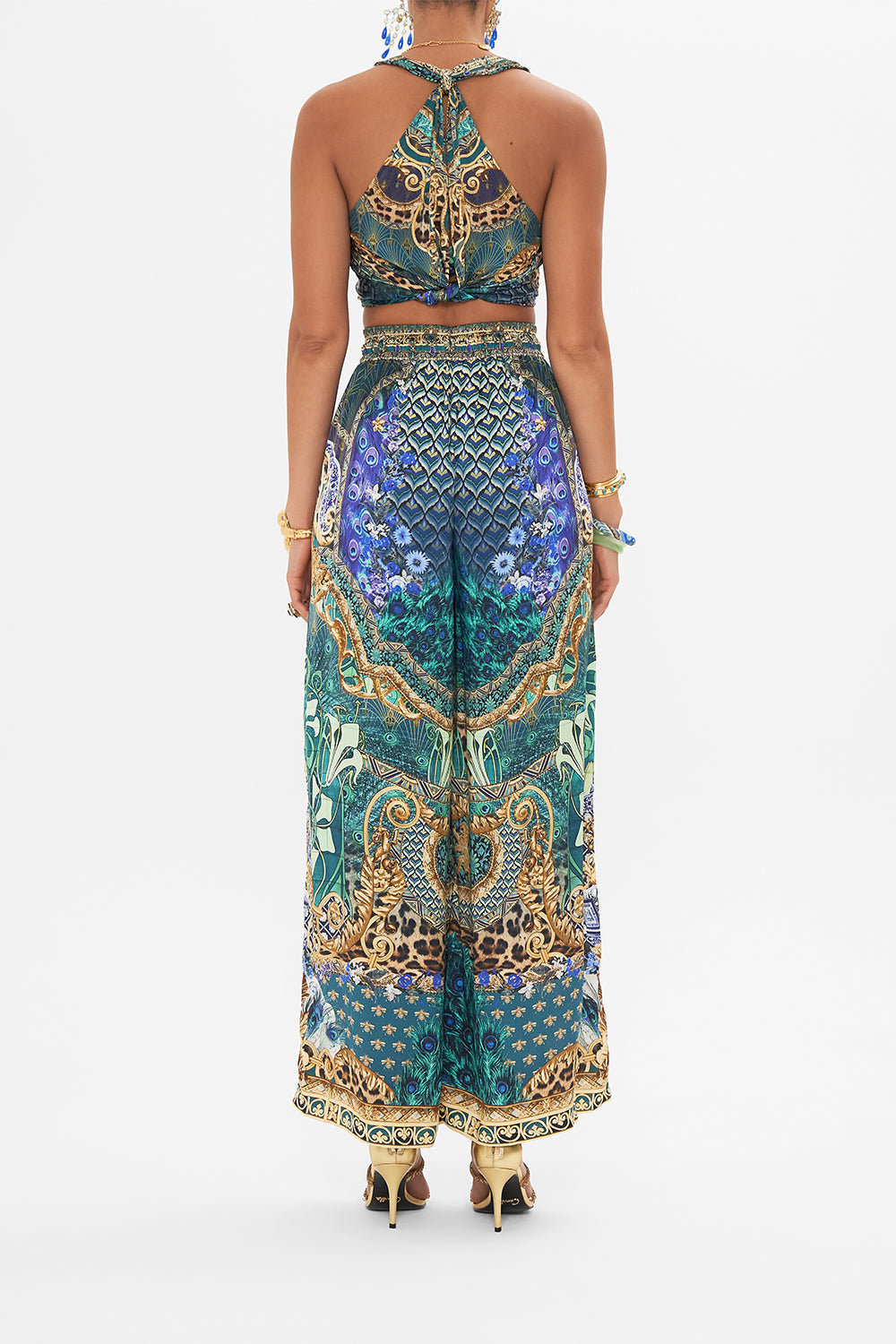 Back view of model wearing CAMILLA silk pants in Fan Dance print 