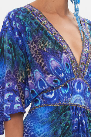 Detail view of model wearing CAMILLA silk ruffle dress in Peacock Rock print