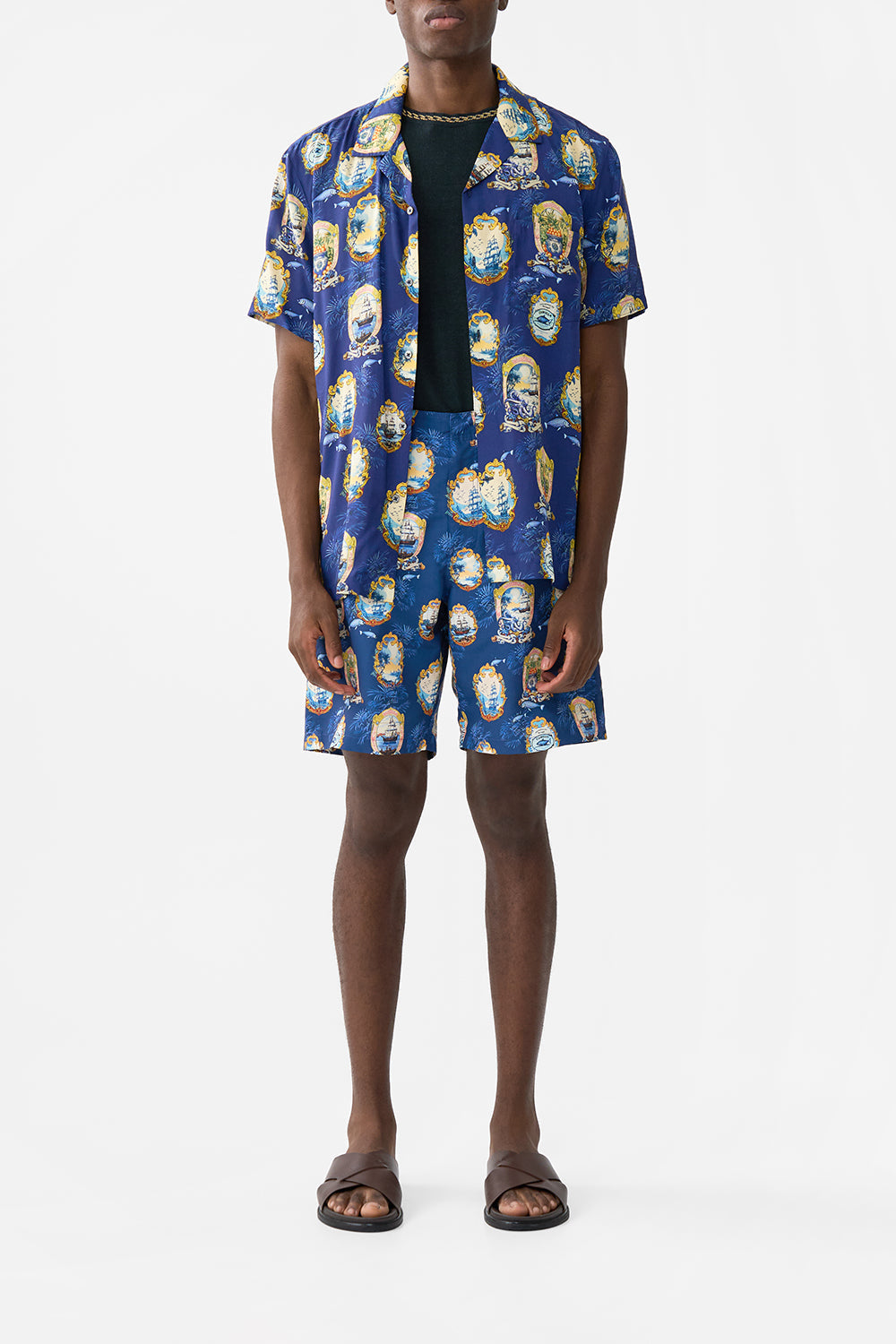 The CAMILLA OVERSIZED BAND TEE WELCOME TO THE WHITE LOTUS in our  print.