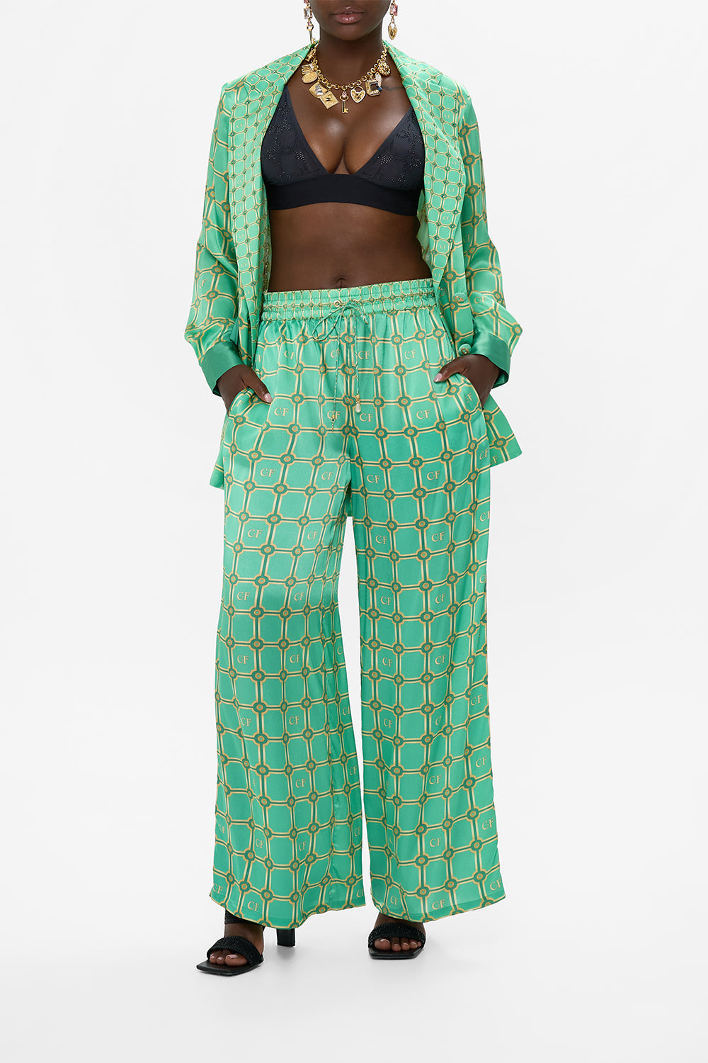 The CAMILLA BLOUSON SLEEVE SWEATER WELCOME TO THE WHITE LOTUS in our  print.