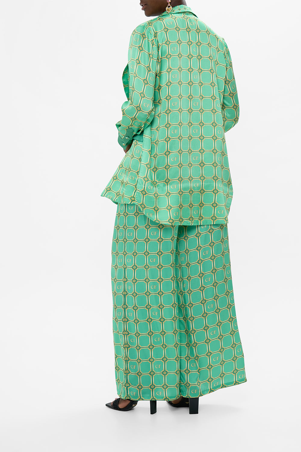 The CAMILLA BLOUSON SLEEVE SWEATER WELCOME TO THE WHITE LOTUS in our  print.