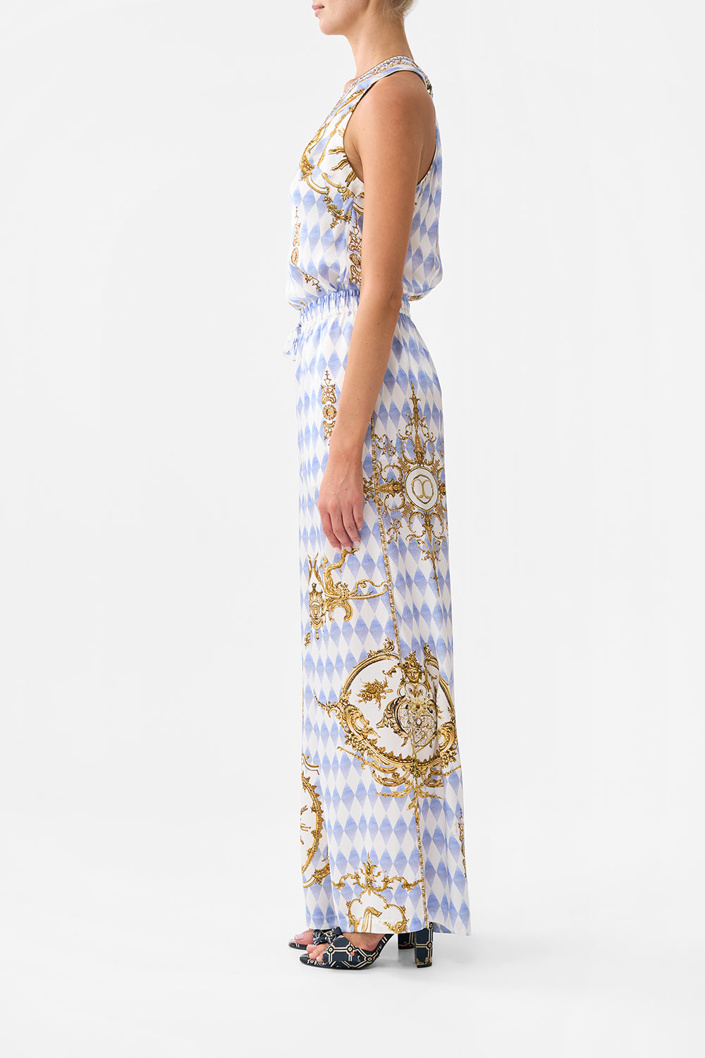 The CAMILLA STEPPED HEM SHIRT SONG OF SAINT ANTHONY in our  print.