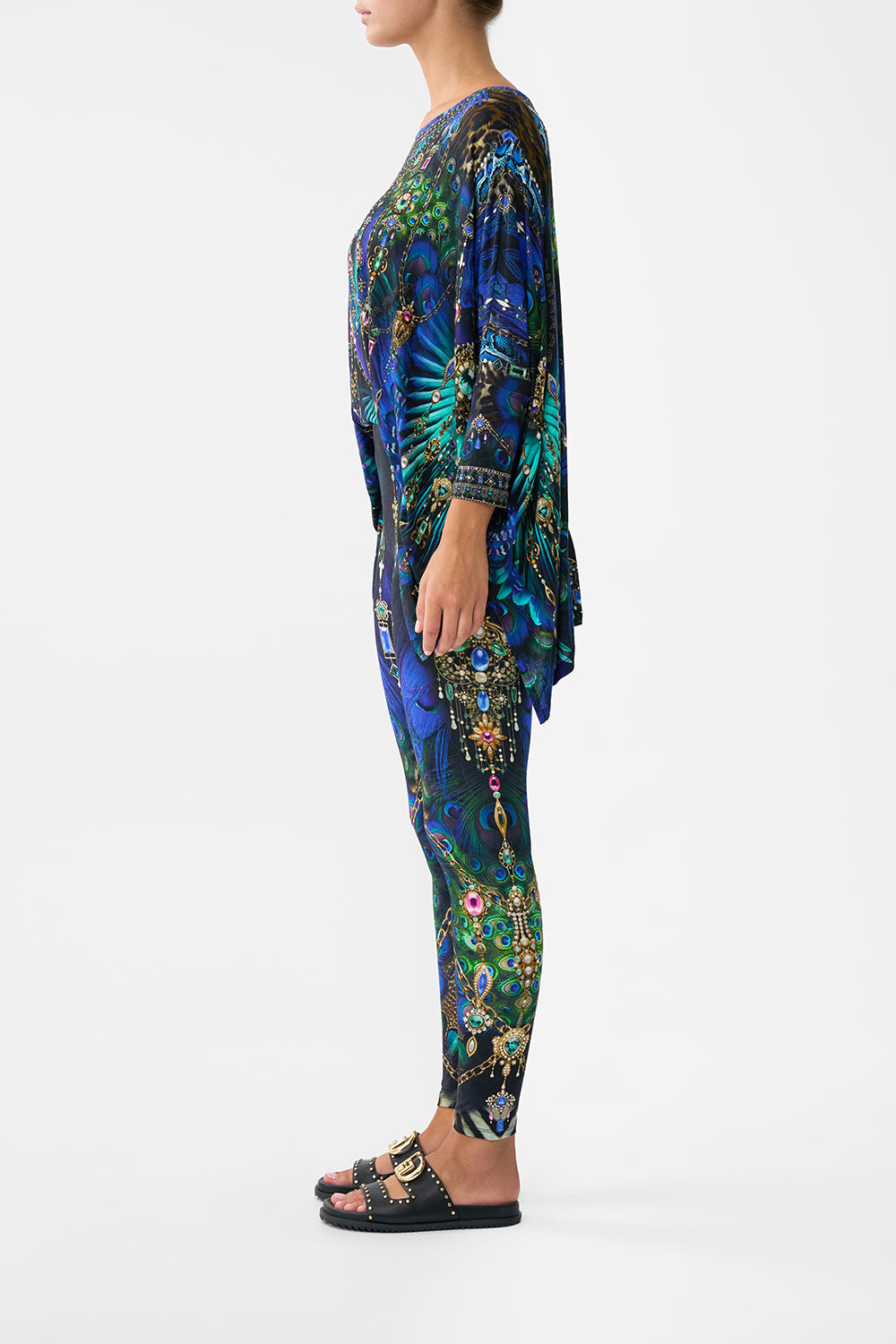 The CAMILLA BANDEAU ONE PIECE WITH EYELET TIE SIDES MAGIC CARPET RIDE in our  print.