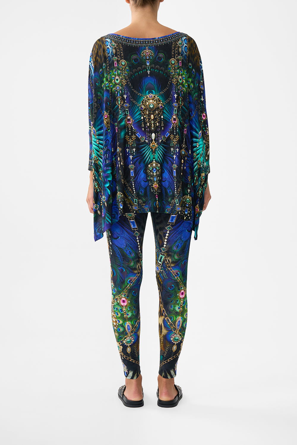 The CAMILLA BANDEAU ONE PIECE WITH EYELET TIE SIDES MAGIC CARPET RIDE in our  print.