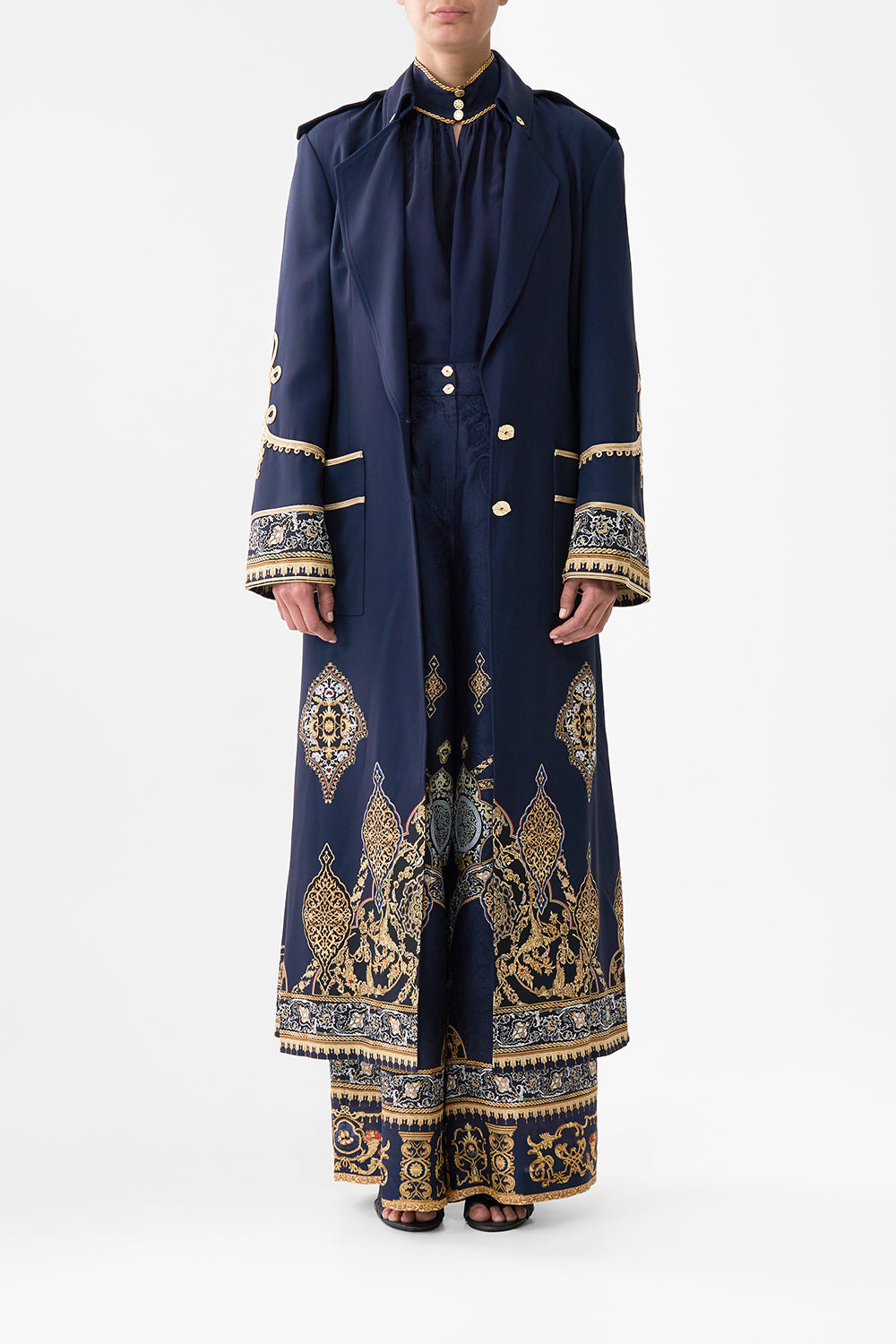 The CAMILLA PLUNGE BACKLESS HALTER ONE PIECE WITH RING TIES CONCUBINES, SULTANS & COURTIERS in our  print.