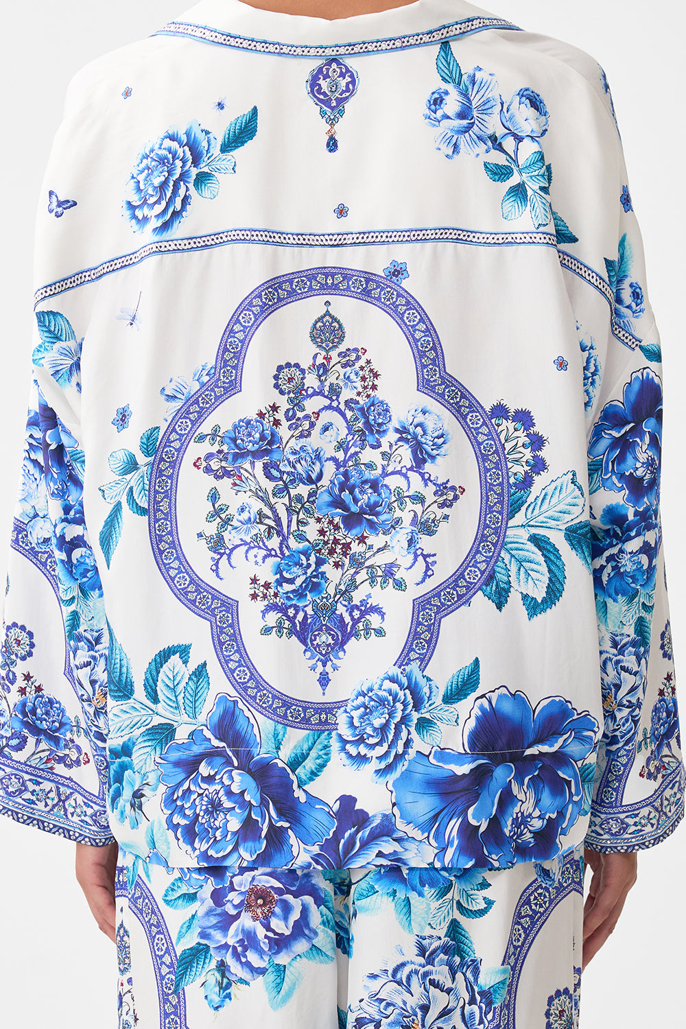 The CAMILLA DRAWSTRING POUCH BAG WITH CHAIN STRAP TILED IN TIME in our  print.