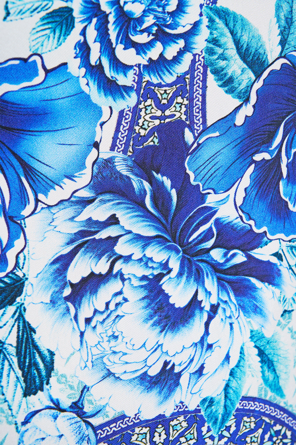 The CAMILLA HALTER BEACH MINI DRESS W CUT OUT WAIST TRIM EMBROIDERED EVER AFTER in our EMBROIDERED EVER AFTER print.