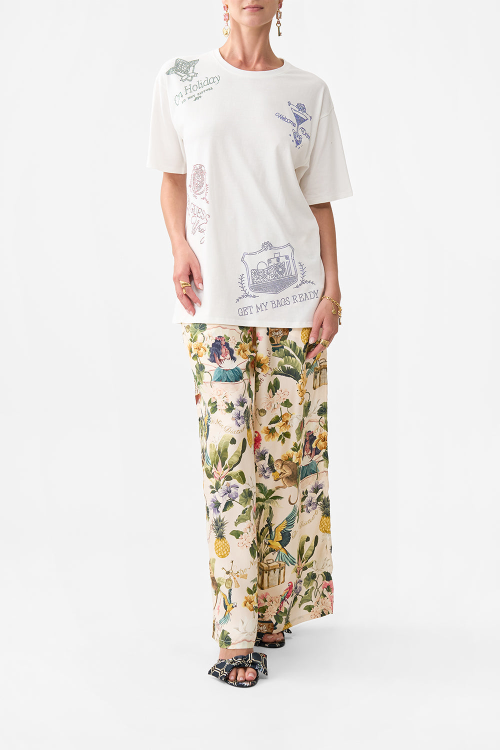 The CAMILLA WIDE LEG TROUSER WITH FRONT POCKETS FAITH, LUCK & JUSTICE in our  print.