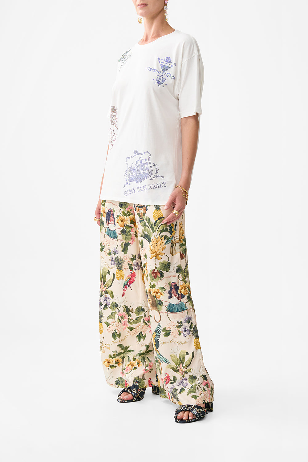 The CAMILLA WIDE LEG TROUSER WITH FRONT POCKETS FAITH, LUCK & JUSTICE in our  print.