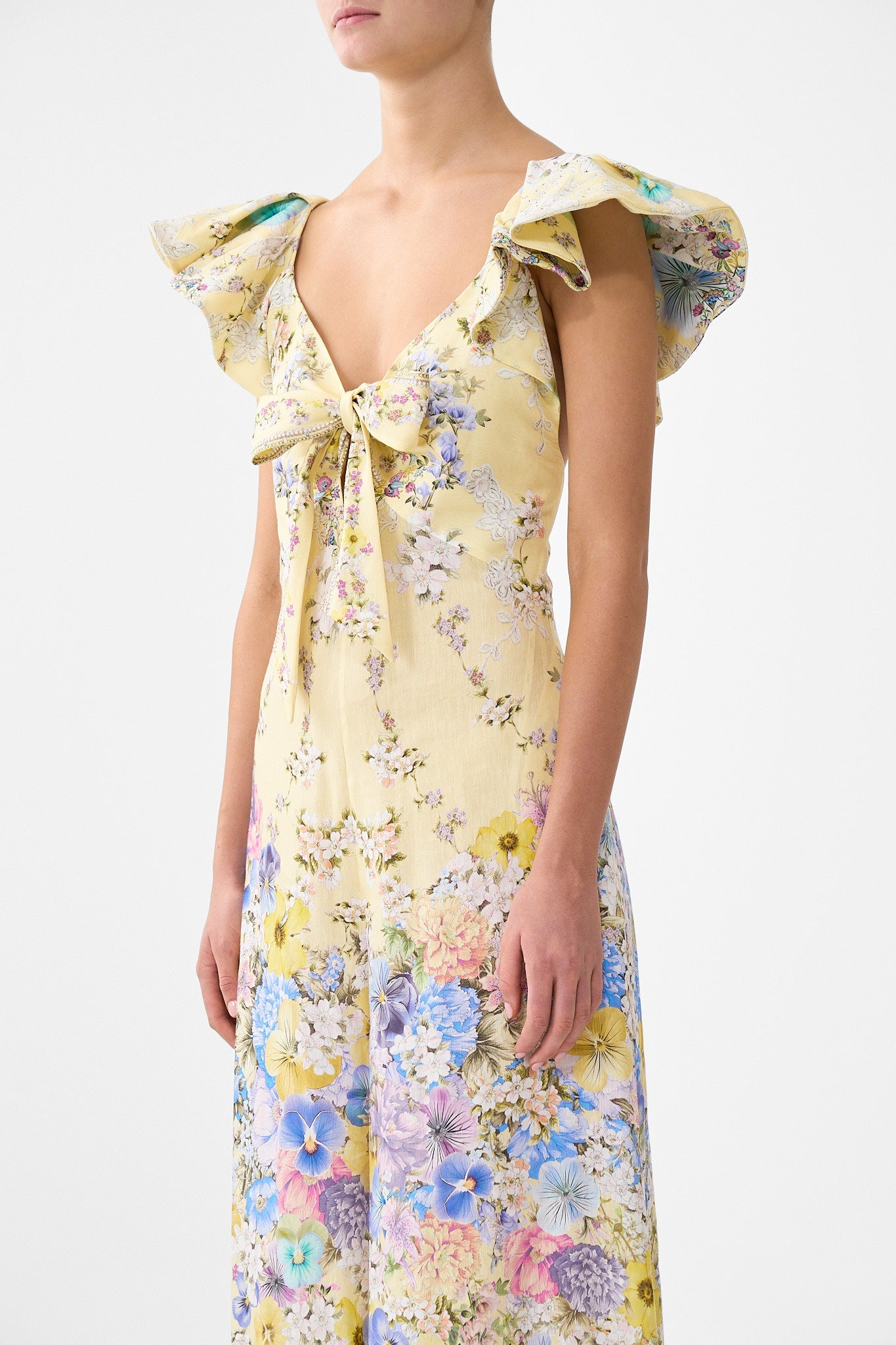 The CAMILLA DRAWSTRING POUCH BAG WITH CHAIN STRAP HEIRLOOM EMPIRE in our HEIRLOOM EMPIRE print.