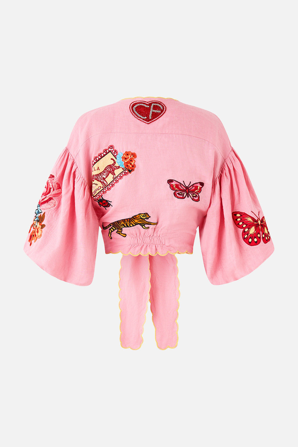 The CAMILLA CROPPED BLOUSON SLEEVE TIE FRONT TOP LEGEND HAS IT in our  print.