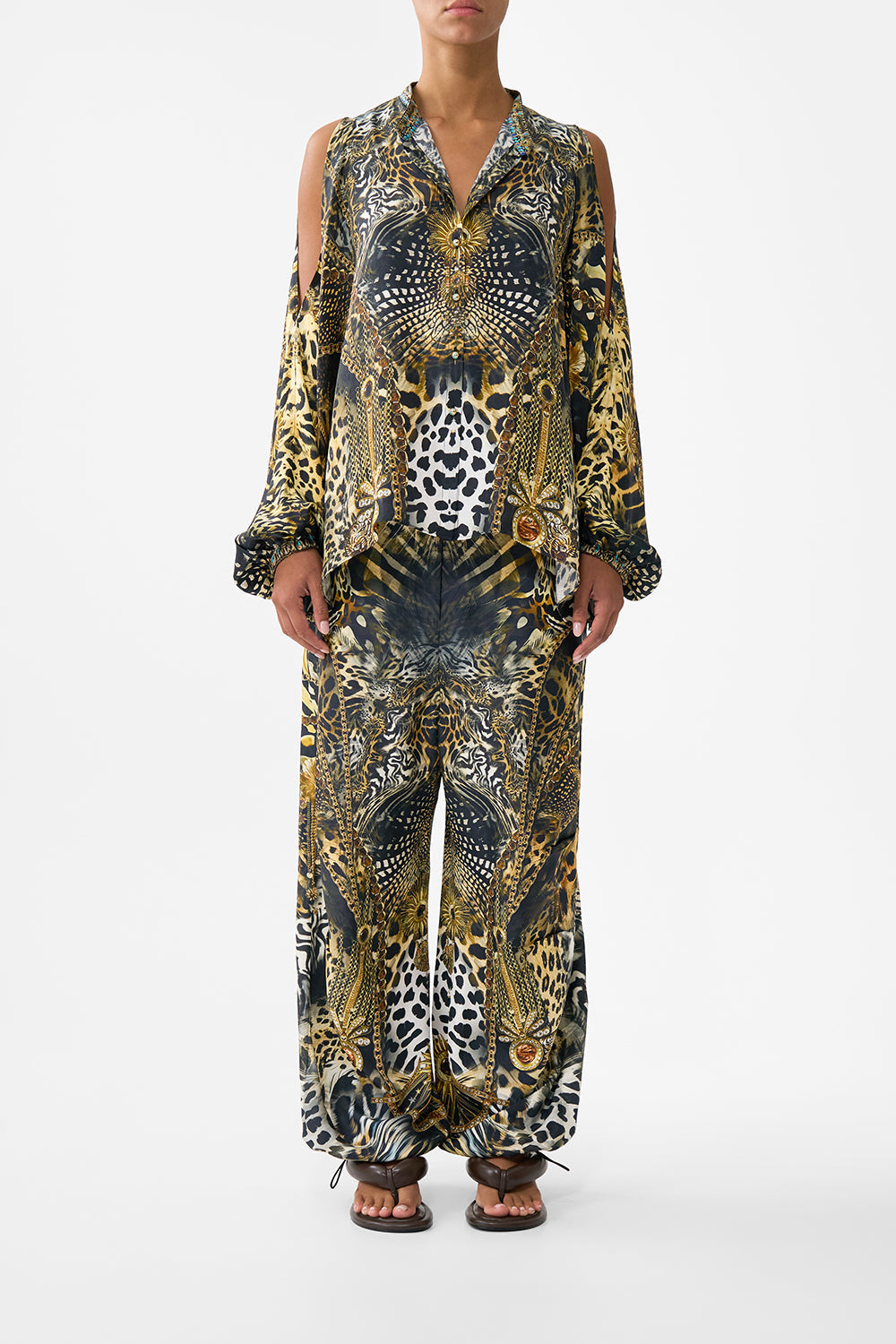 The CAMILLA MID LENGTH BOARDSHORT WITH ELASTIC WAIST AMULETS AND ALCHEMY in our  print.