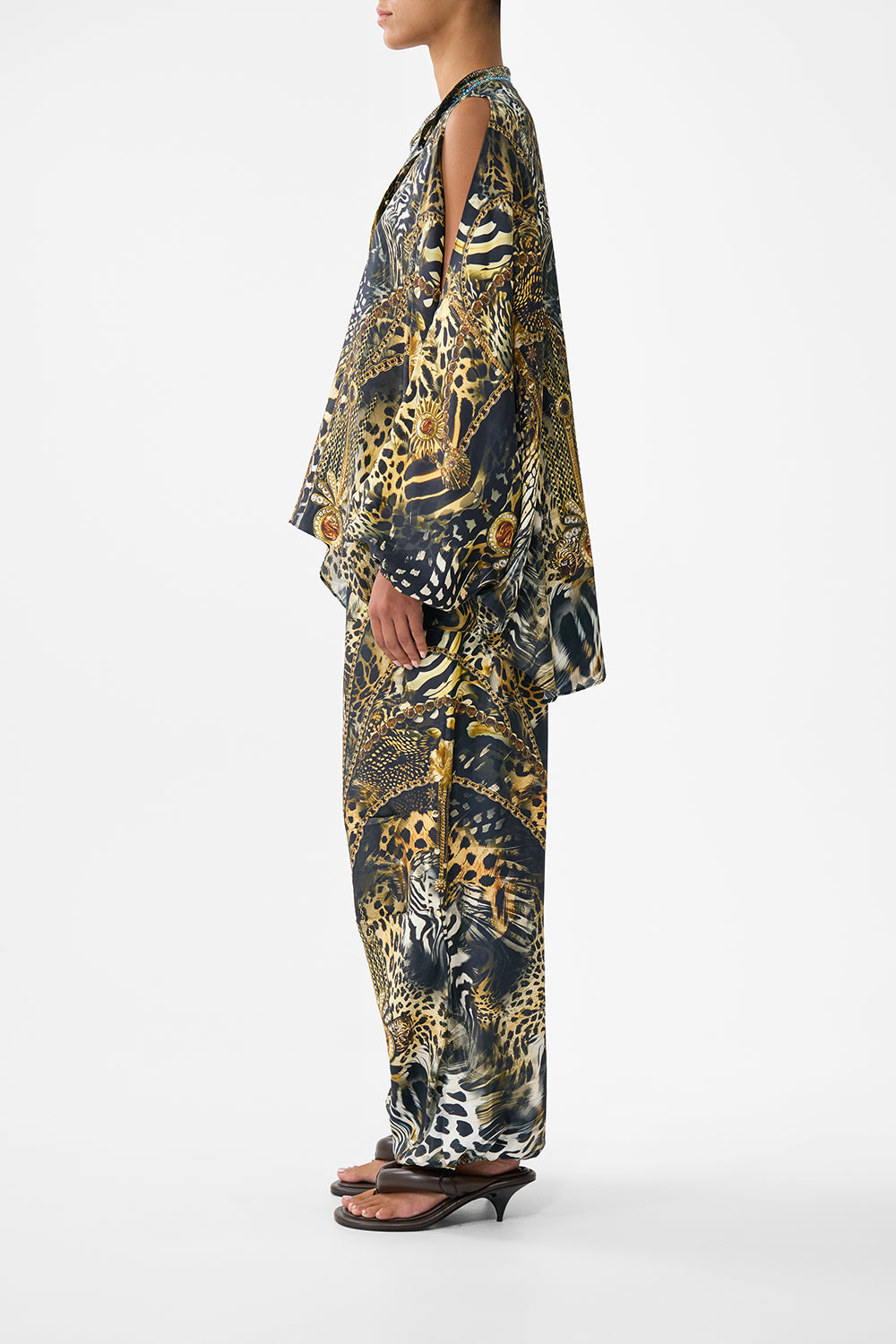 The CAMILLA MID LENGTH BOARDSHORT WITH ELASTIC WAIST AMULETS AND ALCHEMY in our  print.