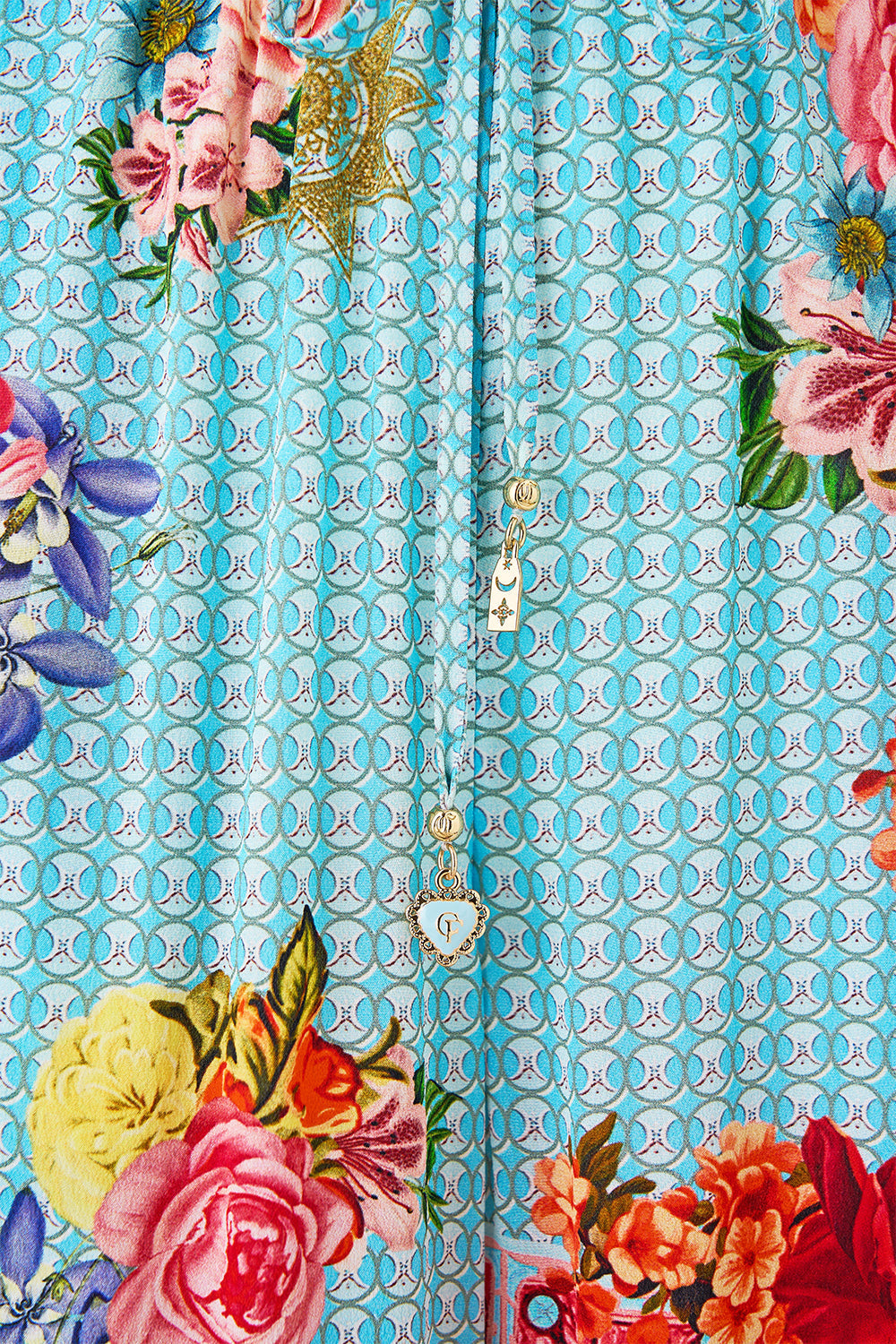 The CAMILLA WAISTED DRESS WITH HEM RUFFLE HEIRLOOM EMPIRE in our  print.