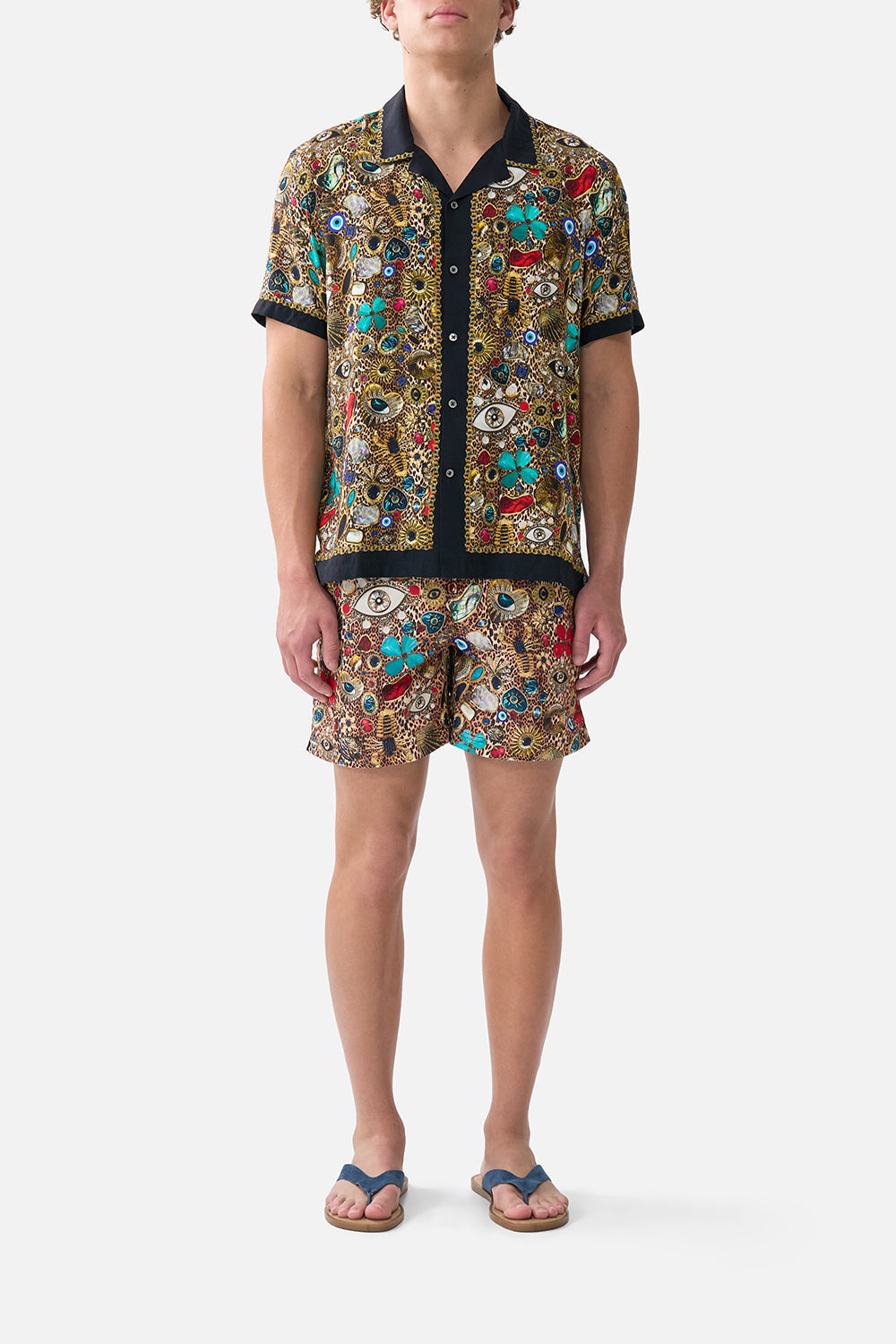 The CAMILLA THROW OVER WITH FEATHERS AMULETS AND ALCHEMY in our  print.