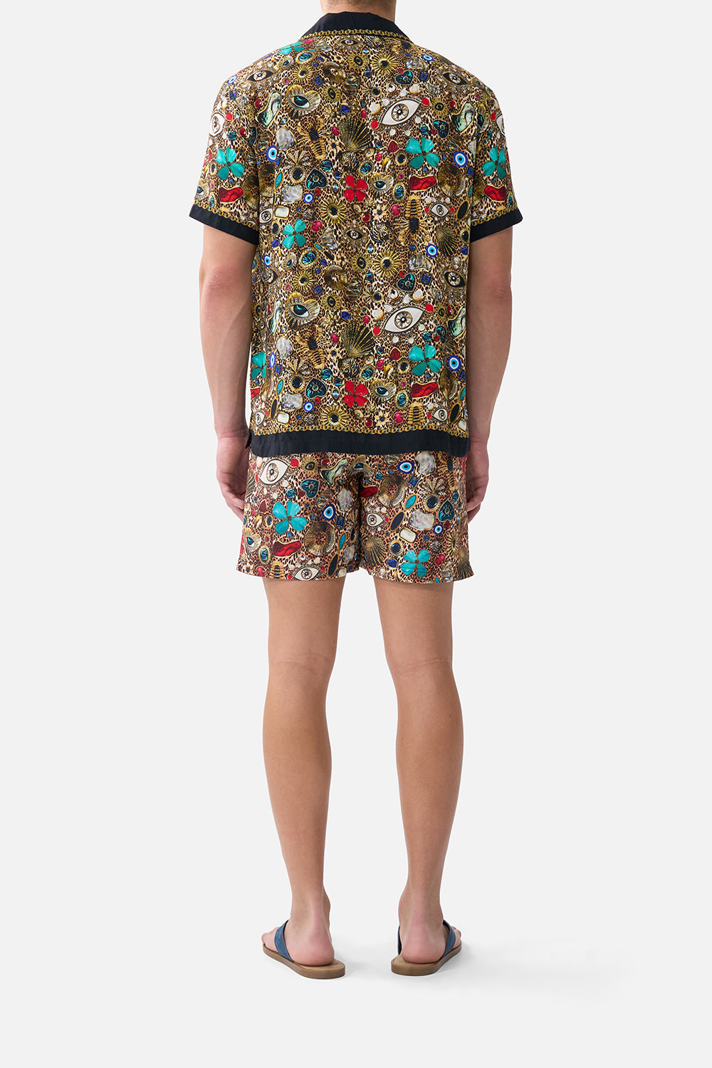 The CAMILLA THROW OVER WITH FEATHERS AMULETS AND ALCHEMY in our  print.