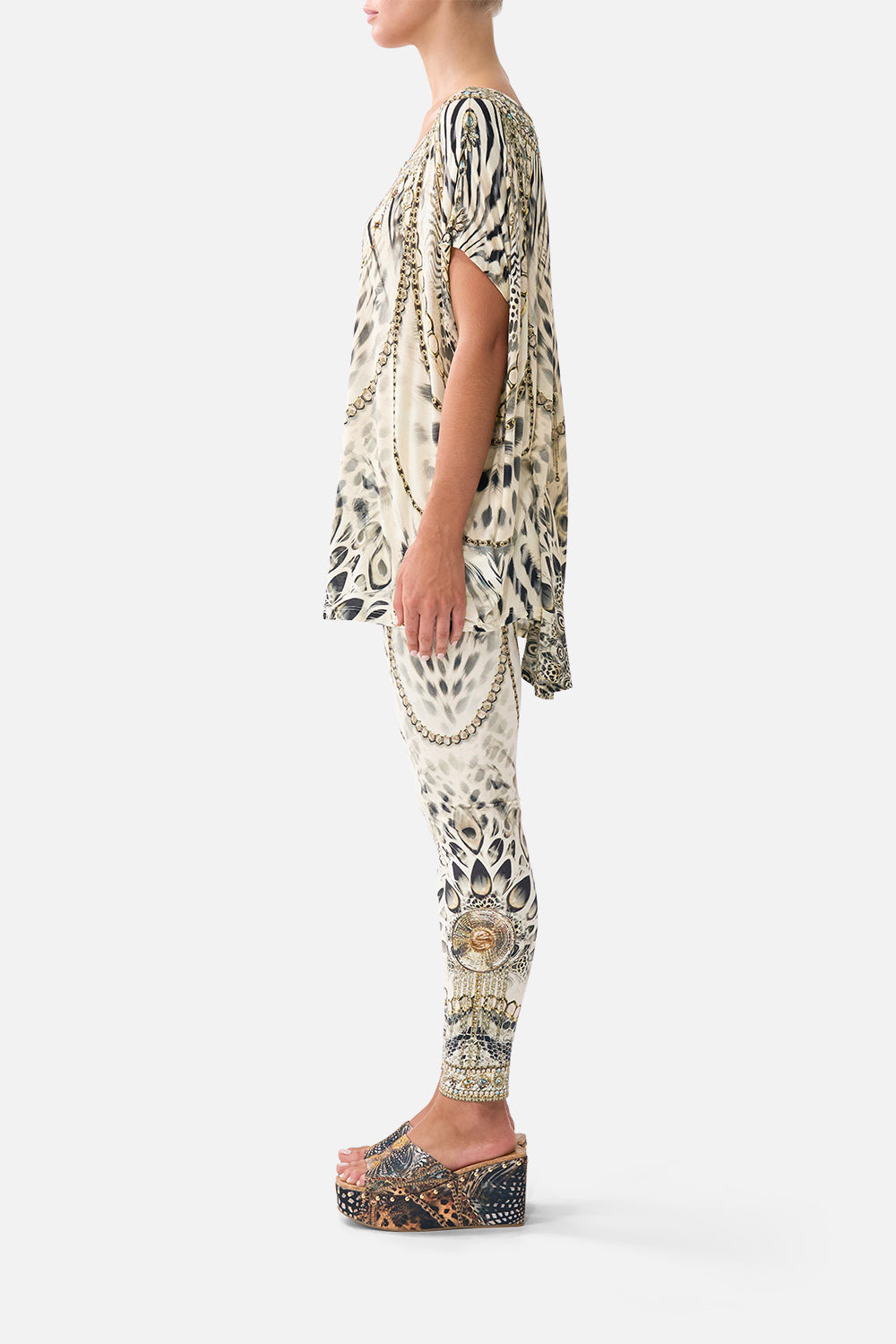 The CAMILLA MULTI STRAP HALTER TRI BIKINI TOP WITH TRIM SEVILLIAN STYLE in our SEVILLIAN STYLE print.