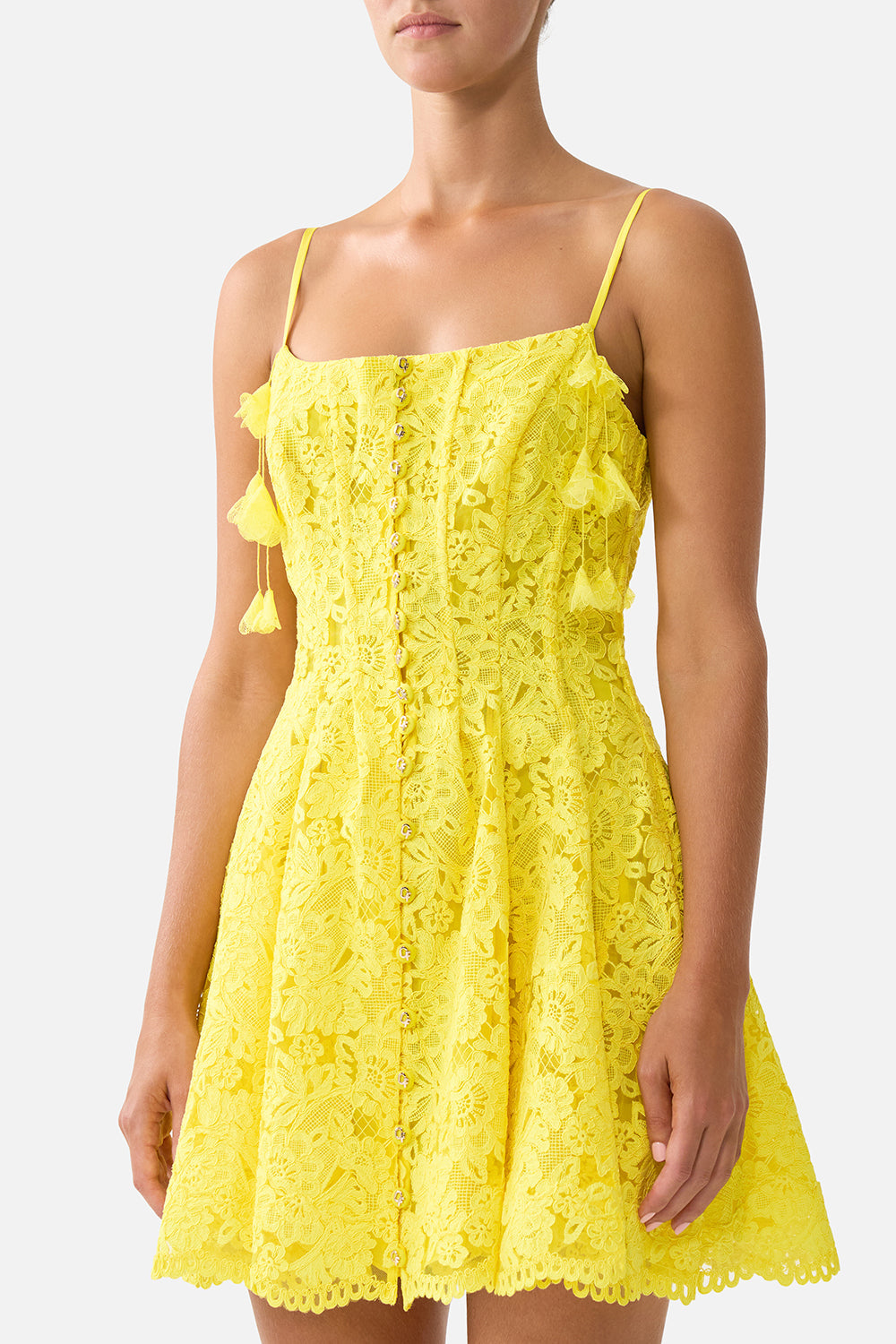 The CAMILLA TIE FRONT SHORT DRESS WITH HEM RUFFLE OLÉ OLÉ in our  print.