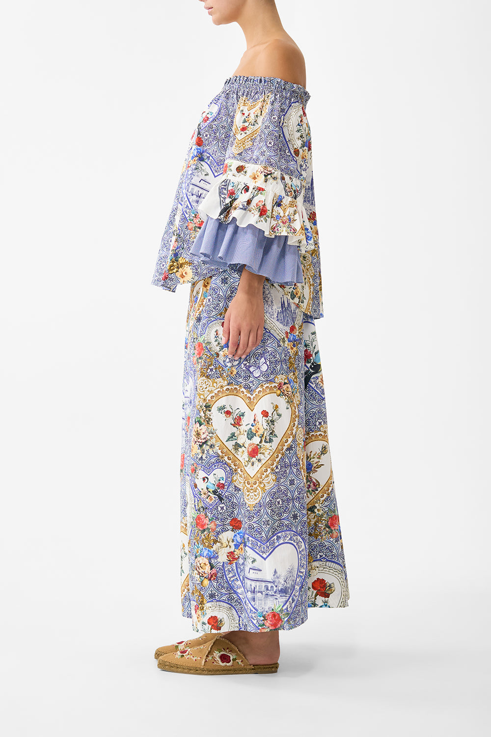 The CAMILLA SHAPED WAISTBAND DRESS WITH FLUTTER SLEEVES ESPAÑA NIRVANA in our ESPAÑA NIRVANA print.