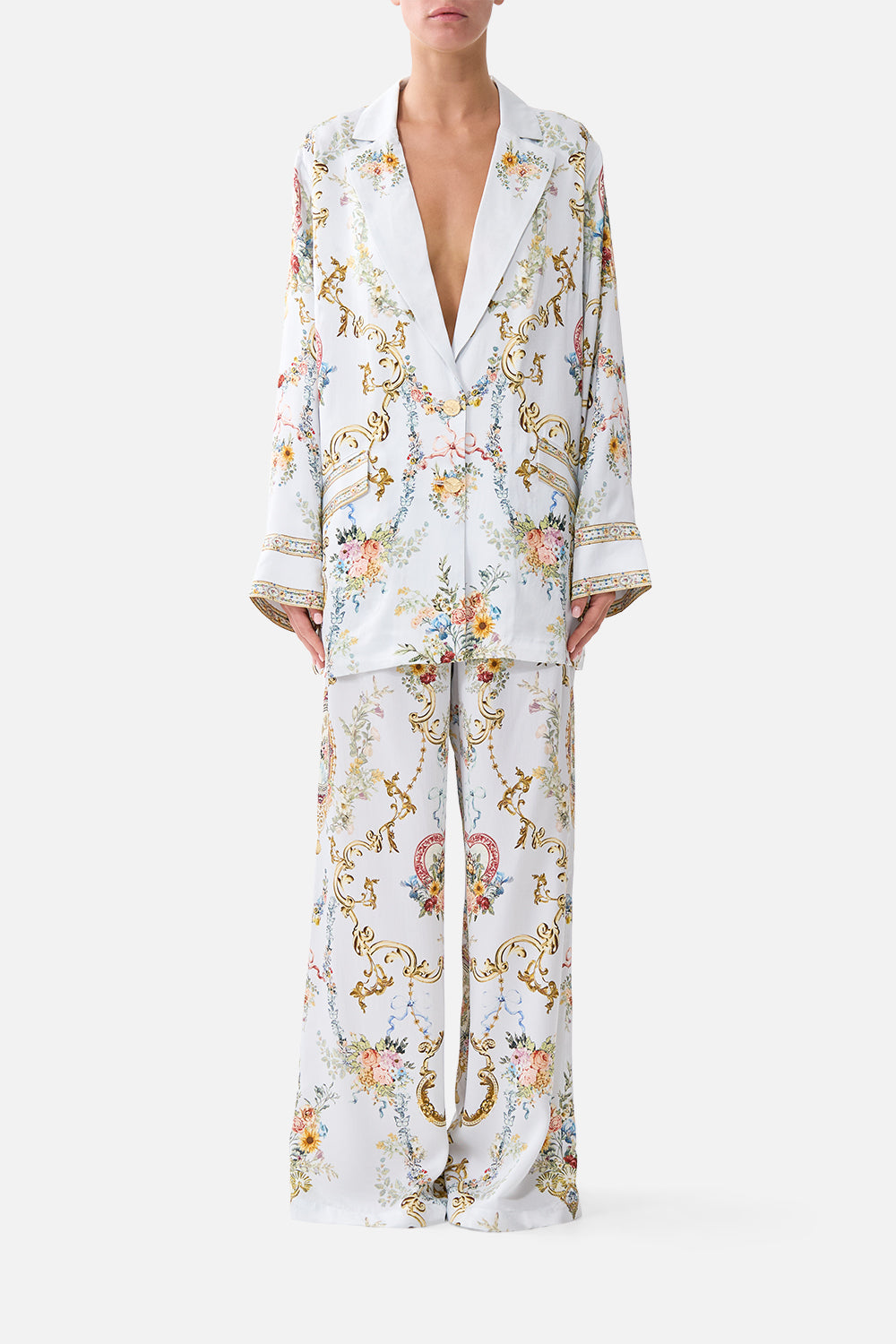 The CAMILLA TIE FRONT UNDERWIRE BIKINI TOP WITH PUFF SLEEVE THE CALL OF CATALONIA in our  print.