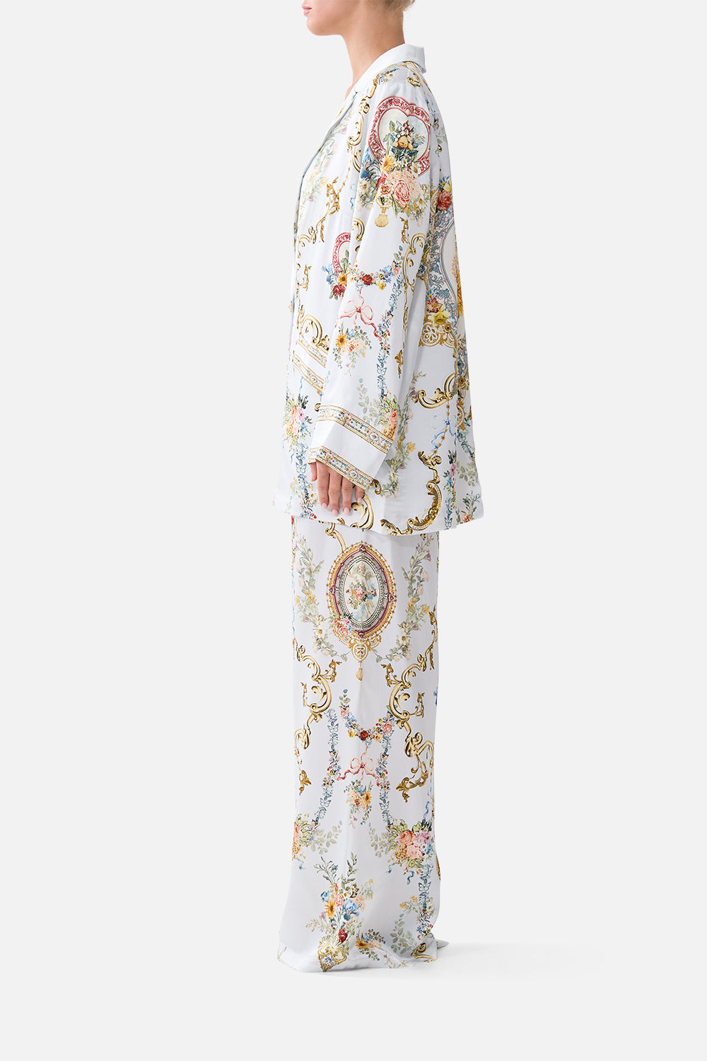The CAMILLA TIE FRONT UNDERWIRE BIKINI TOP WITH PUFF SLEEVE THE CALL OF CATALONIA in our  print.