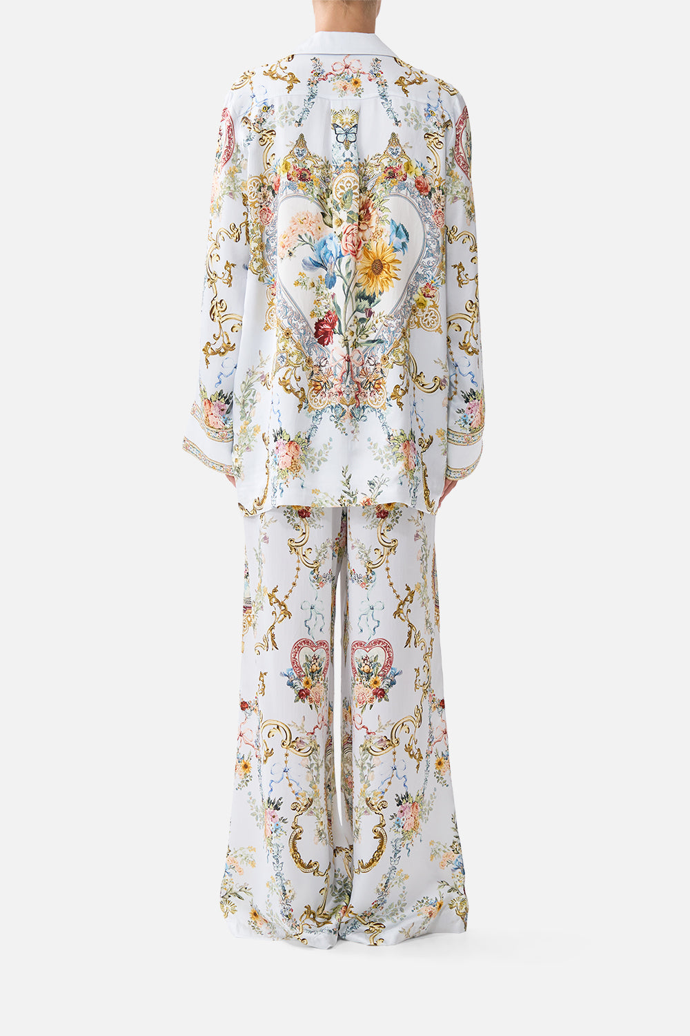 The CAMILLA TIE FRONT UNDERWIRE BIKINI TOP WITH PUFF SLEEVE THE CALL OF CATALONIA in our  print.