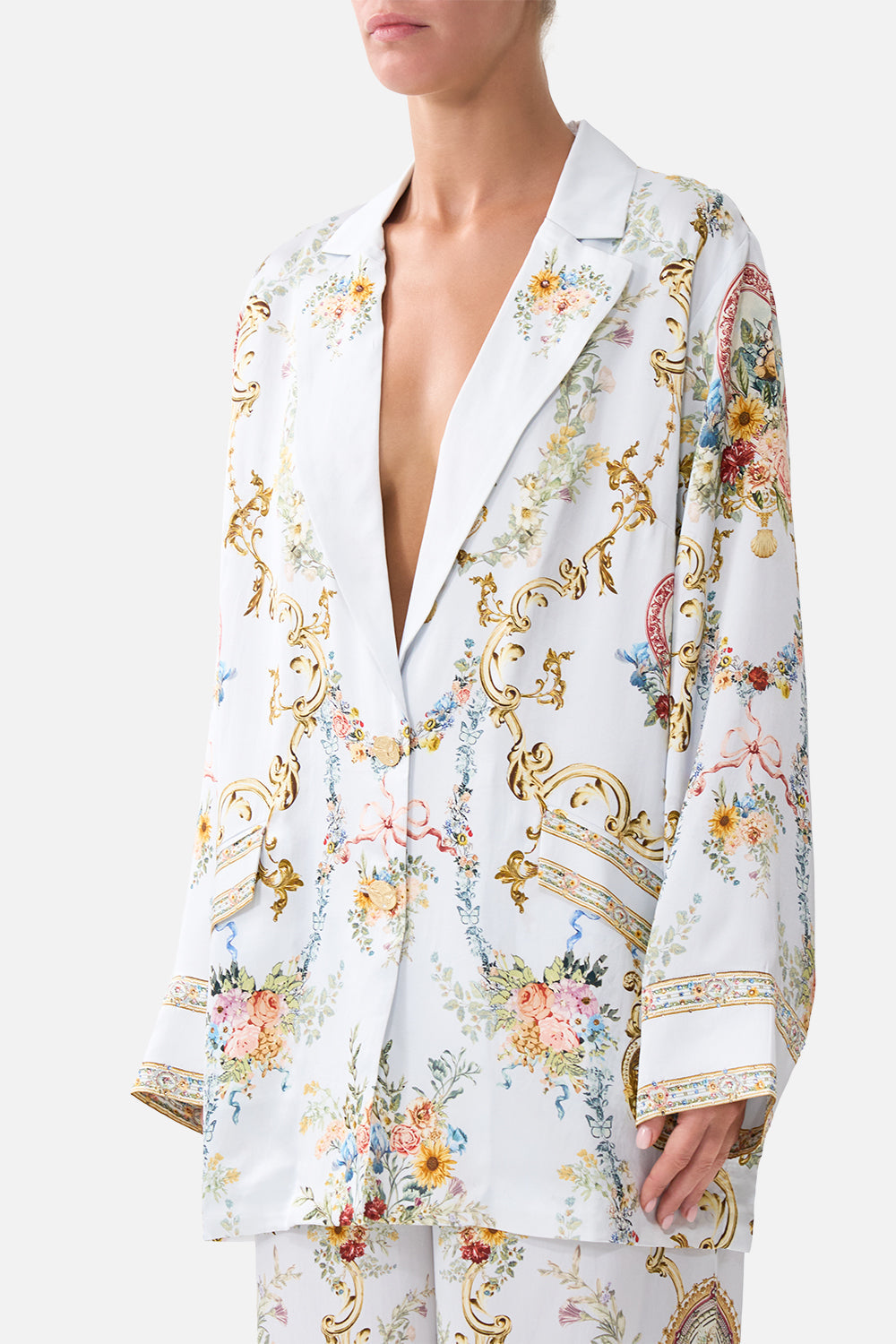 The CAMILLA TIE FRONT UNDERWIRE BIKINI TOP WITH PUFF SLEEVE THE CALL OF CATALONIA in our  print.
