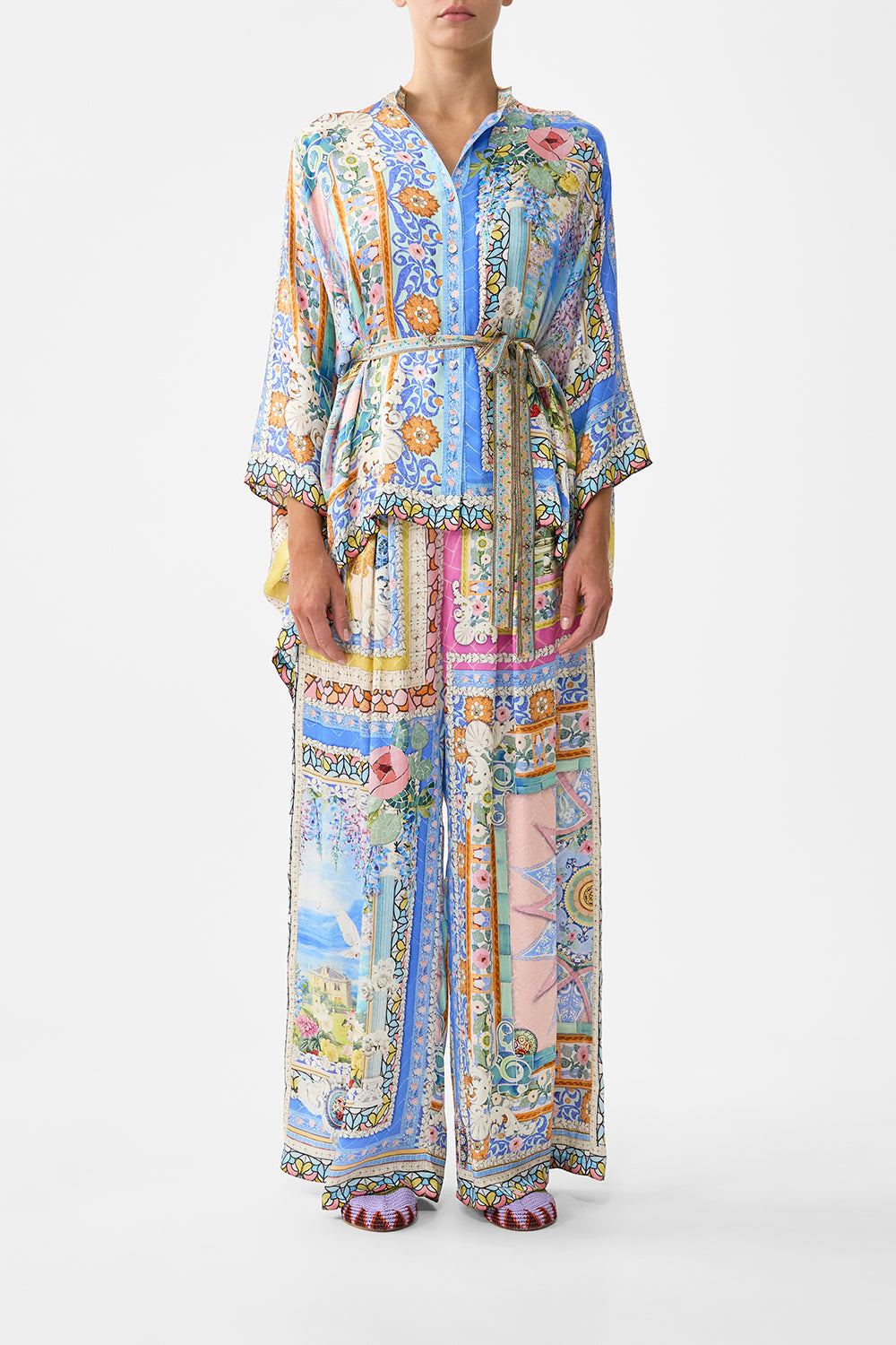 The CAMILLA TIE TOP BUCKET BAG WITH TASSELS MEET ME IN MALLORCA in our  print.