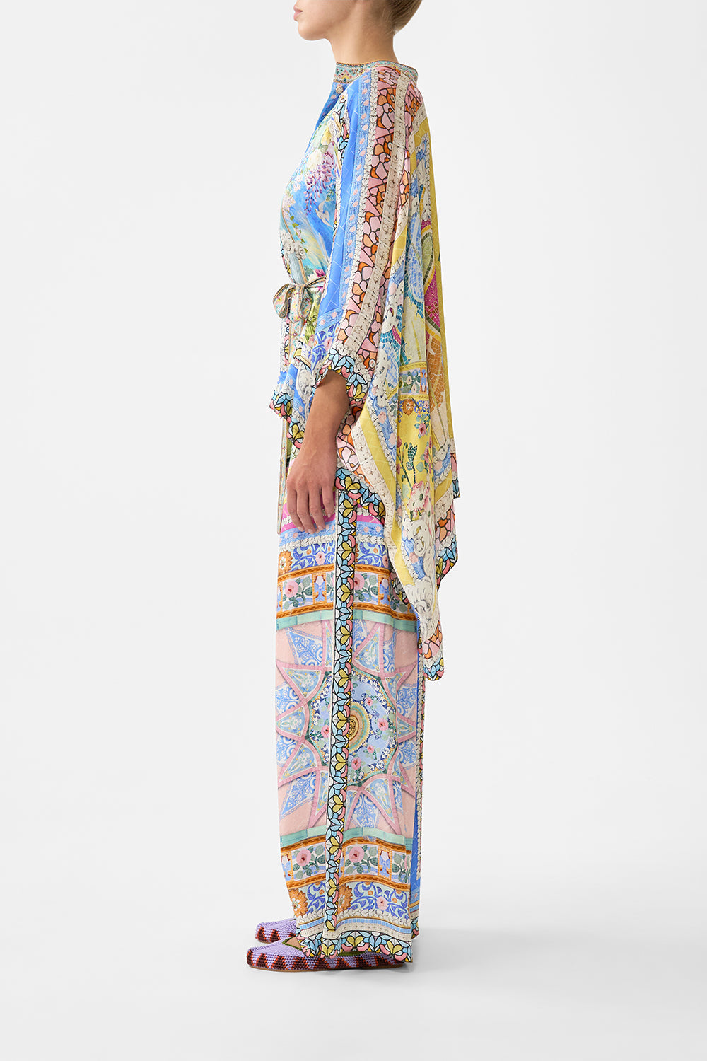 The CAMILLA TIE TOP BUCKET BAG WITH TASSELS MEET ME IN MALLORCA in our  print.
