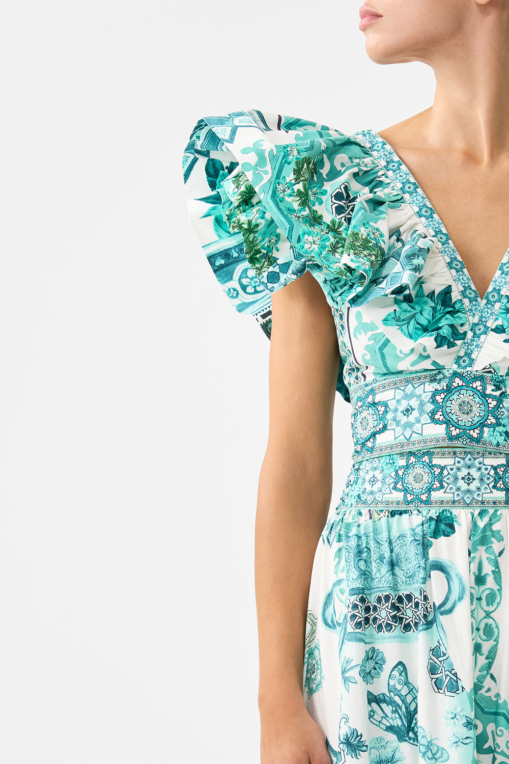The CAMILLA RUFFLE WRAP TOP DAUGHTERS OF DUENDE in our DAUGHTERS OF DUENDE print.