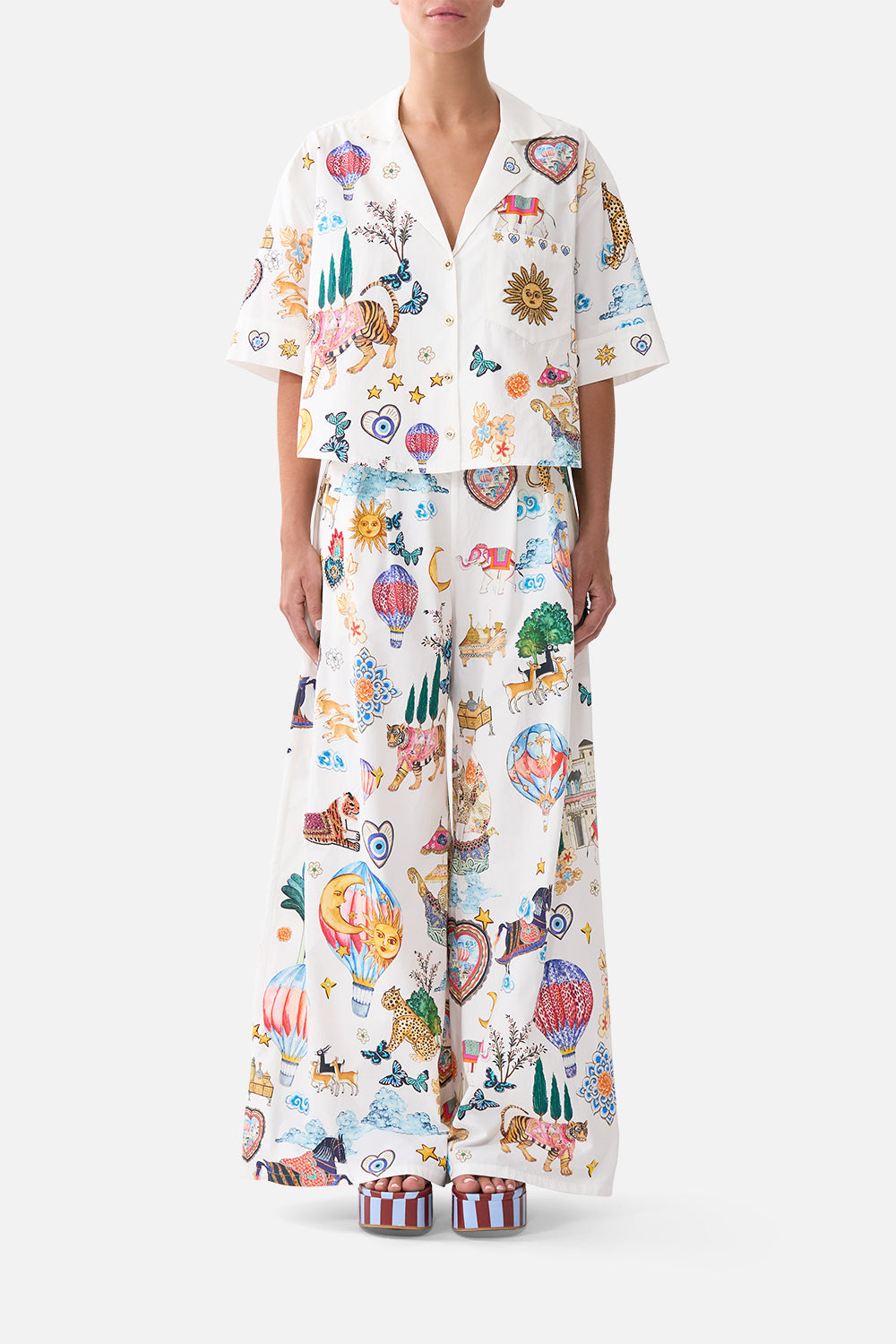 The CAMILLA RELAXED V NECK KNIT TOP NOTES FROM THE BLUE ROOM in our  print.