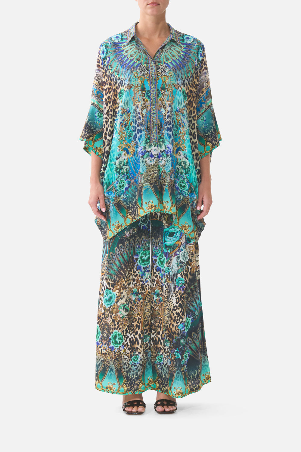 The CAMILLA LONG V NECK KAFTAN WITH RING FRONT TRIM MEET ME IN MALLORCA in our  print.