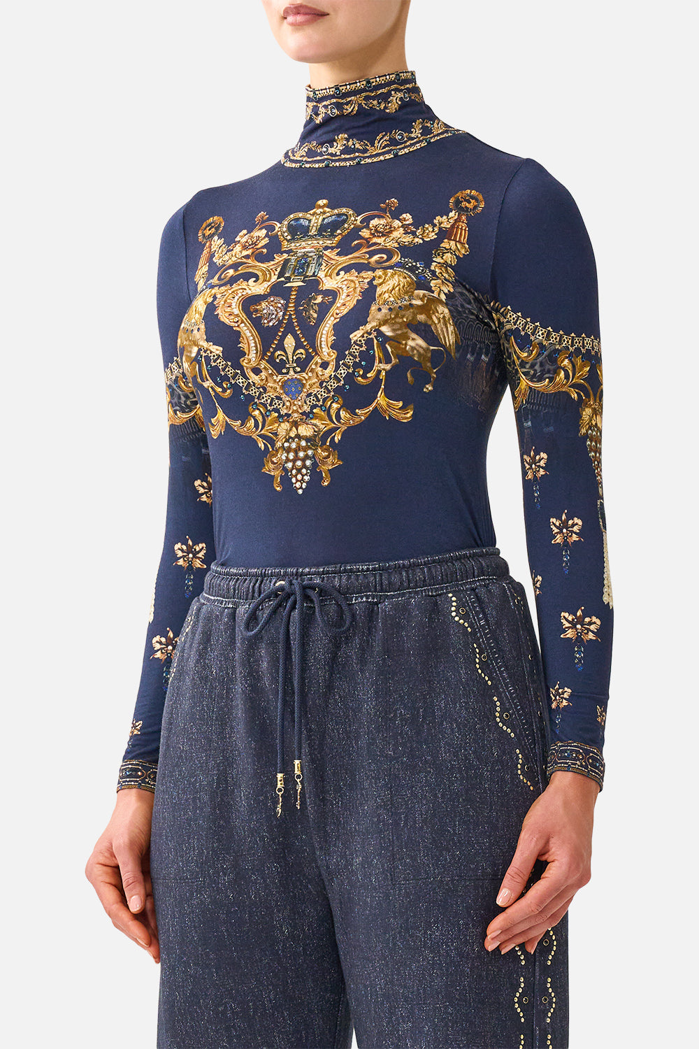 The CAMILLA Jersey Turtleneck in our Cloaked in Baroque print, detail view on model.