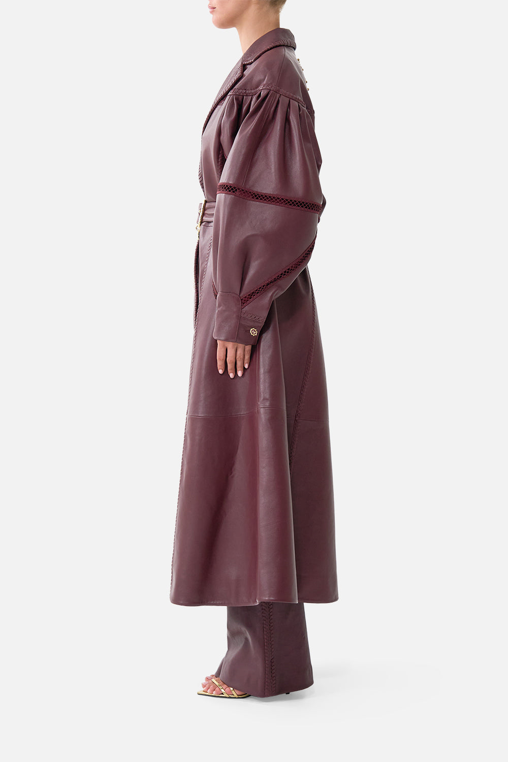 The CAMILLA Leather Coat with Tucked Sleeves in our Call Me a Carriage print, side view on model.
