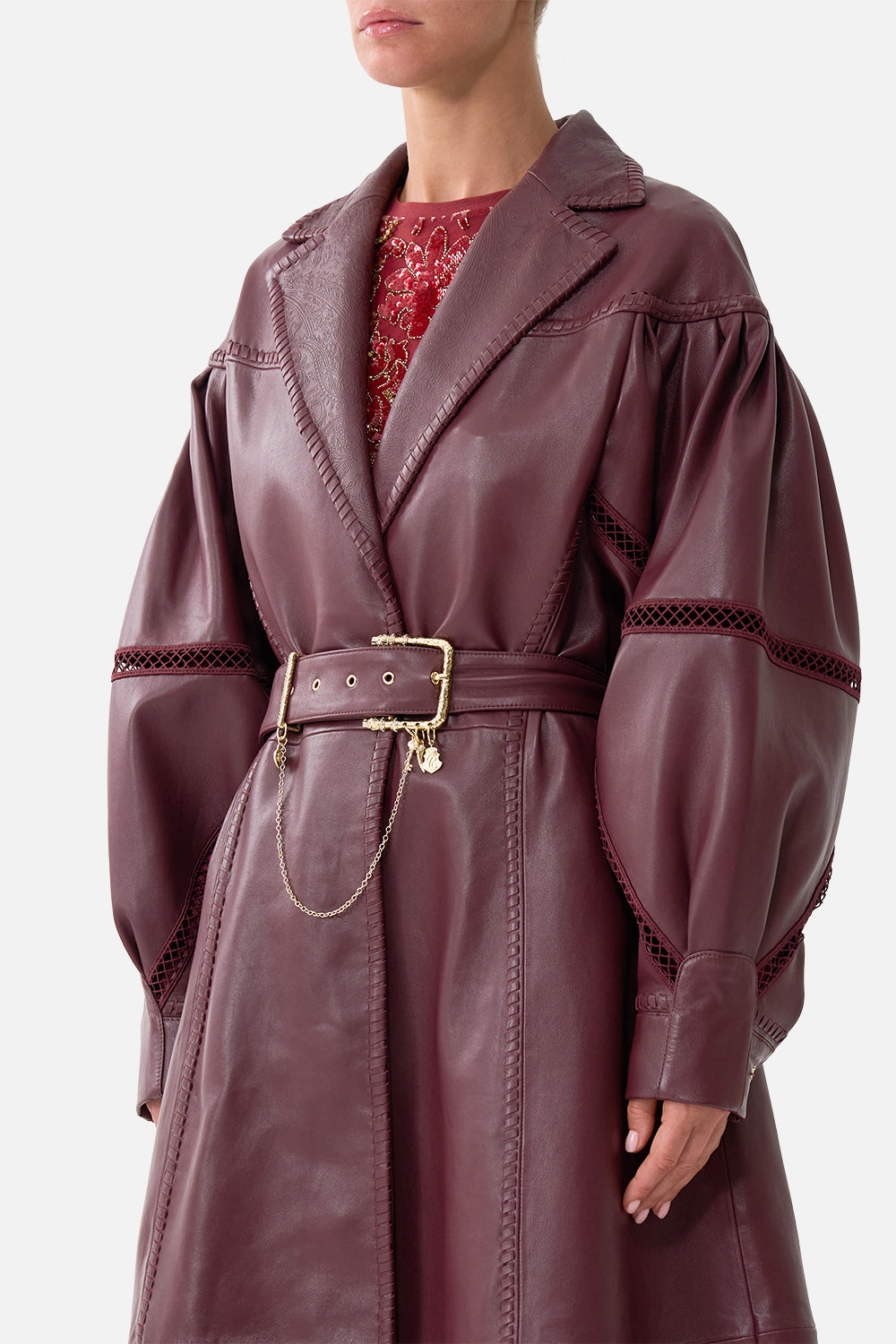 The CAMILLA Leather Coat with Tucked Sleeves in our Call Me a Carriage print, detail view on model.