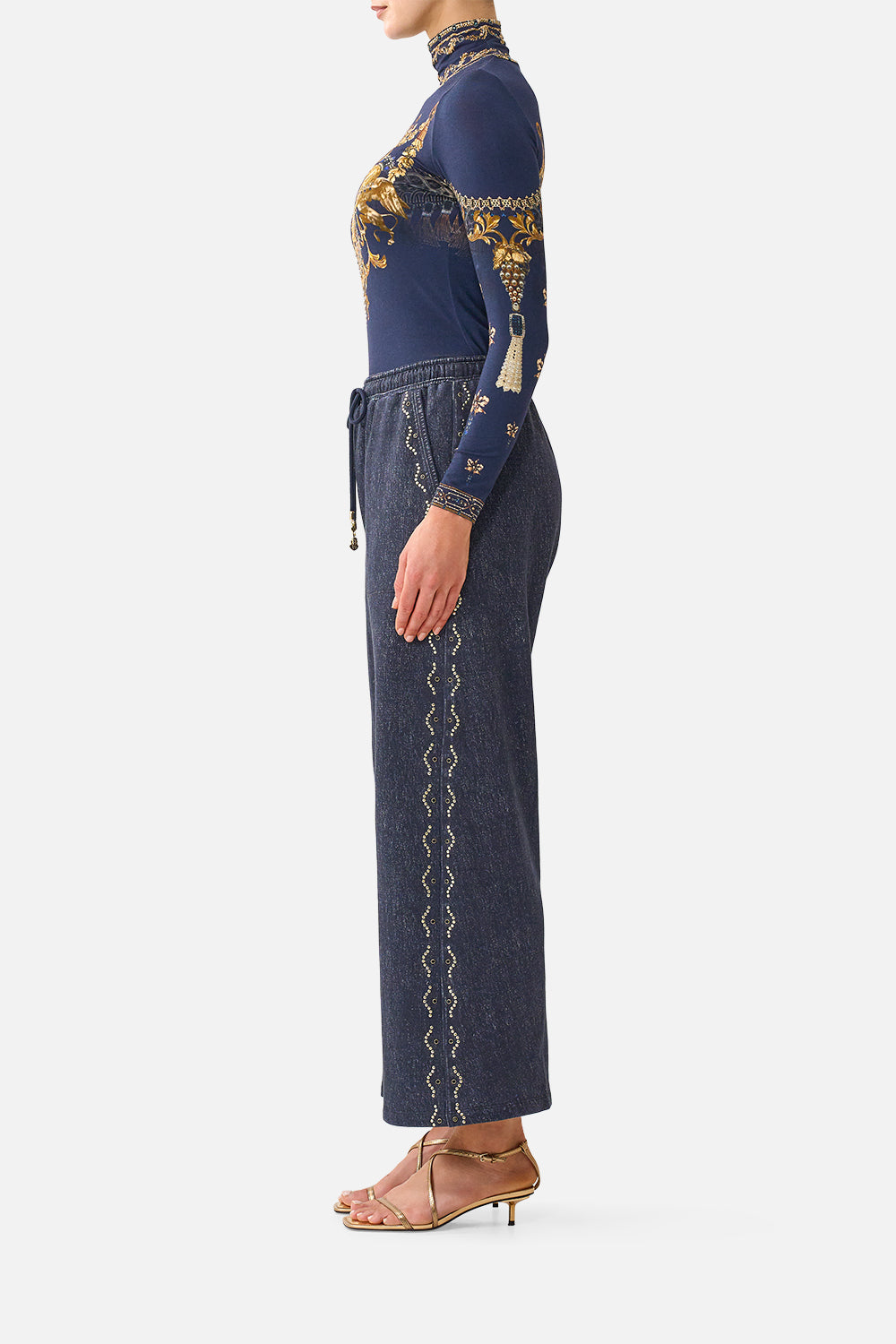 The CAMILLA Straight Leg Track Pant in our Cloaked in Baroque print, side view on model.