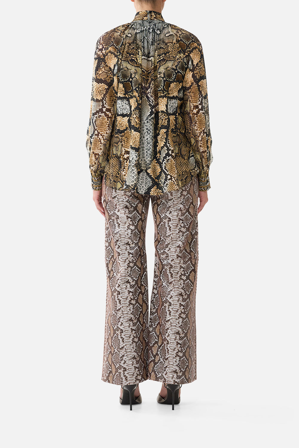 The CAMILLA High Rise Flared Leather Pant in Print Animalia Heirlooms. Model View