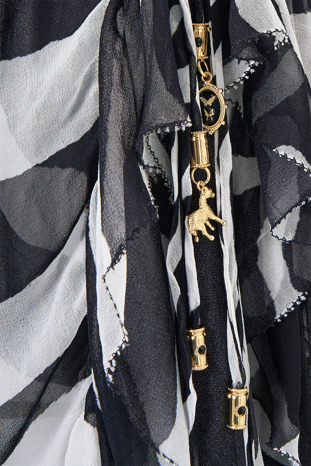 The CAMILLA Relaxed Wrap Tie Skirt With Ruffle in Print Zig Zag Zoo. Ghost View