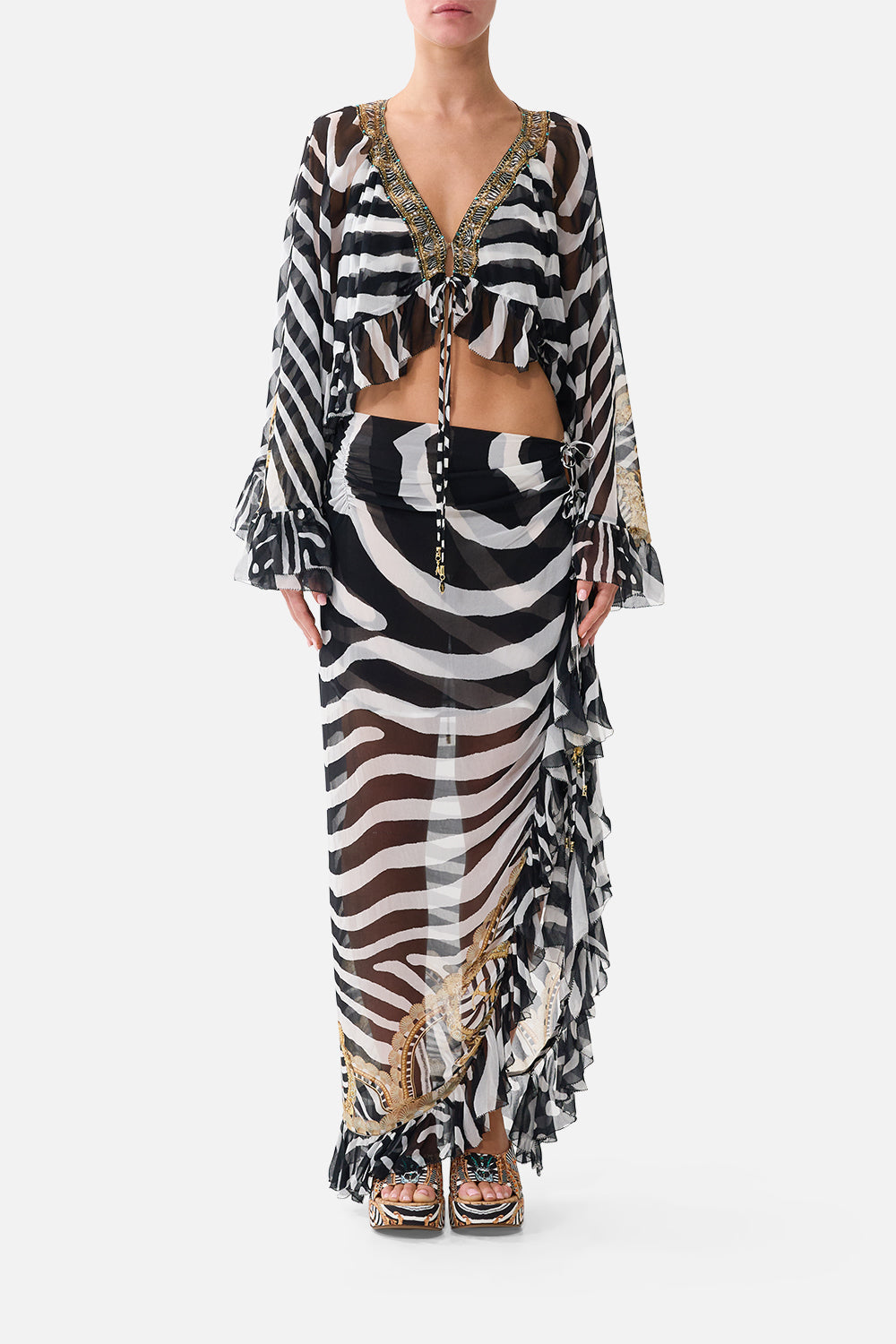 The CAMILLA Relaxed Wrap Tie Skirt With Ruffle in Print Zig Zag Zoo. Model View