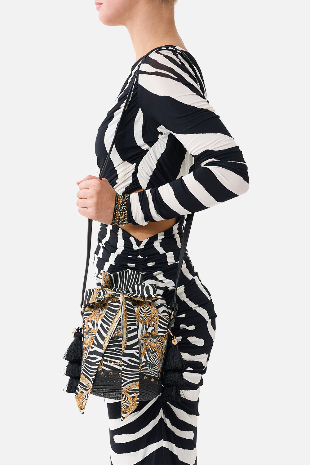 The CAMILLA Tie Top Bucket Bag with Tassels in our Zig Zag Zoo print, side view on model.