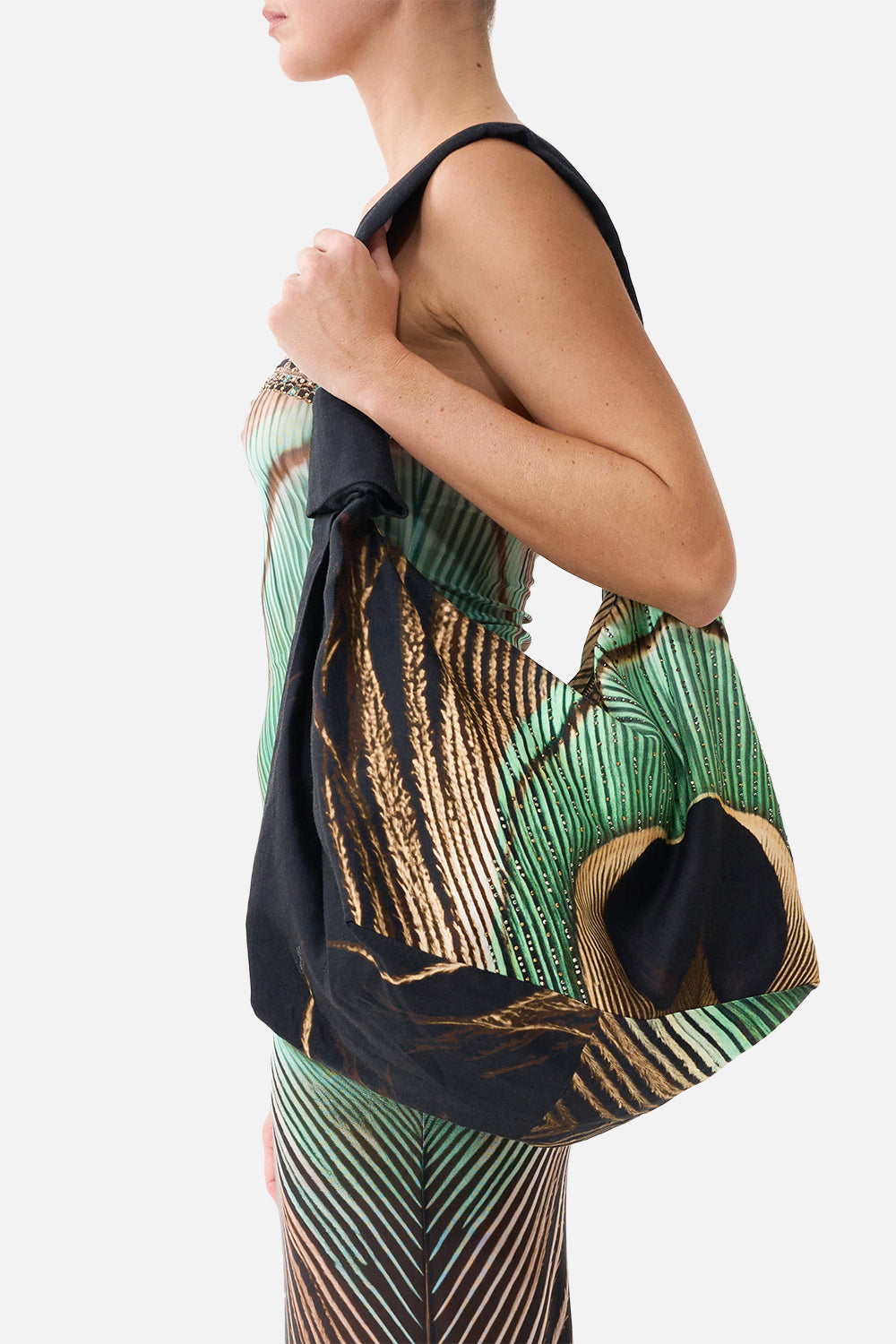 The CAMILLA Slouch Shoulder Bag with Knot Details in our A Wink to the Wild print, side view on model.
