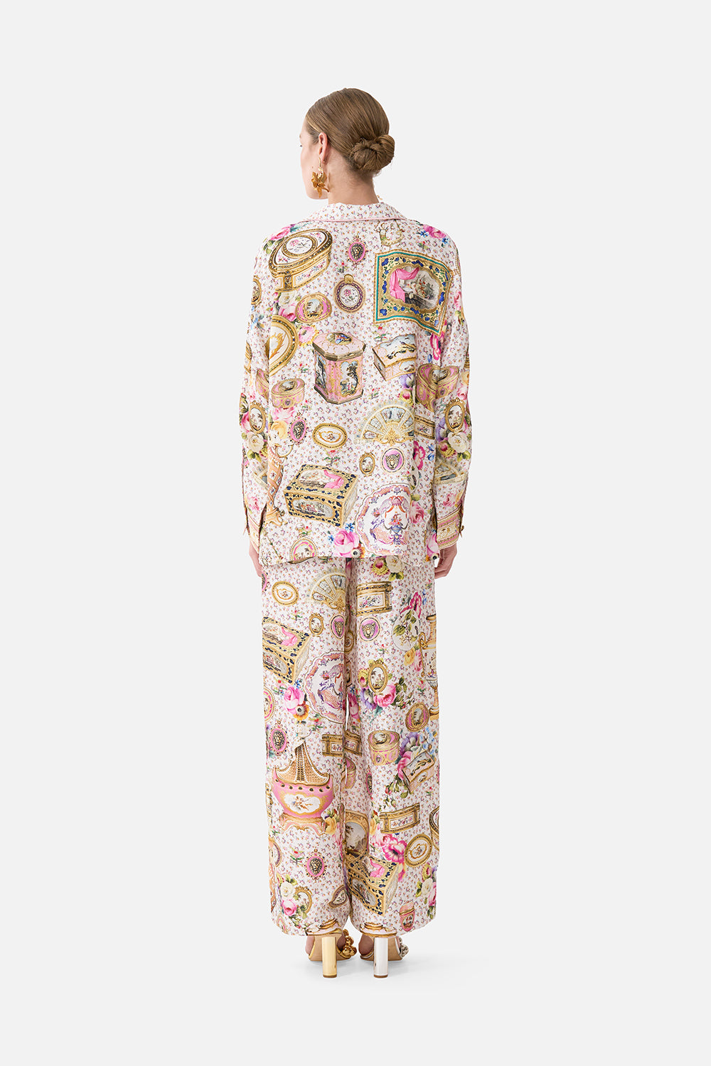 The CAMILLA KIDS ROUND NECK ONE PIECE W FRILL NECK DANDELION SKIES in our  print.