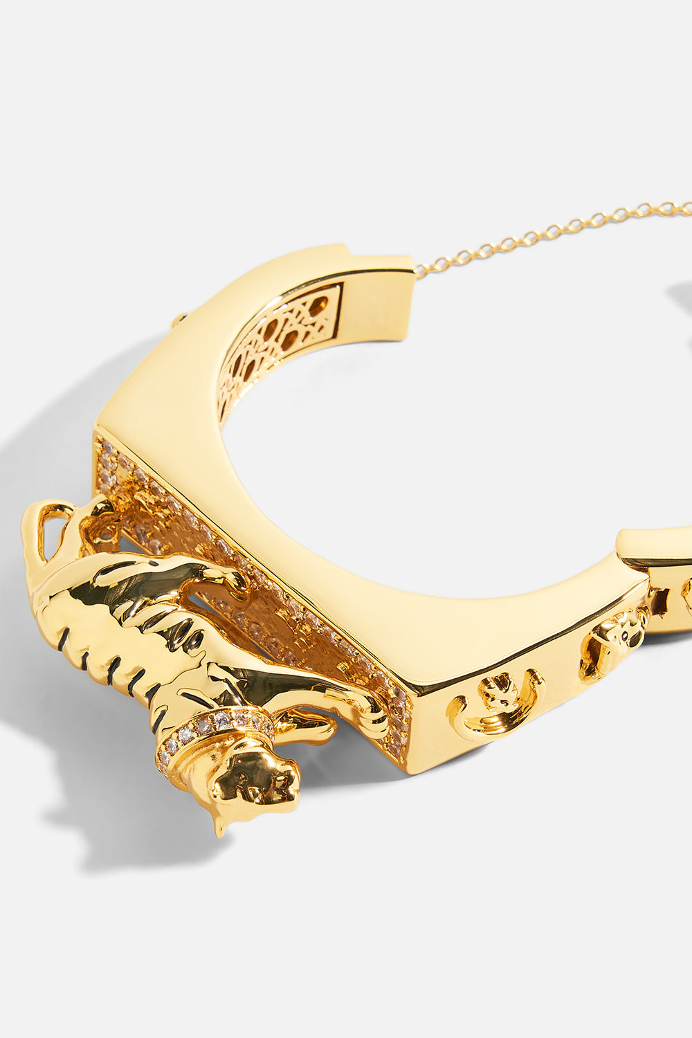 The CAMILLA Gilded Realms Leopard Cuff in gold.