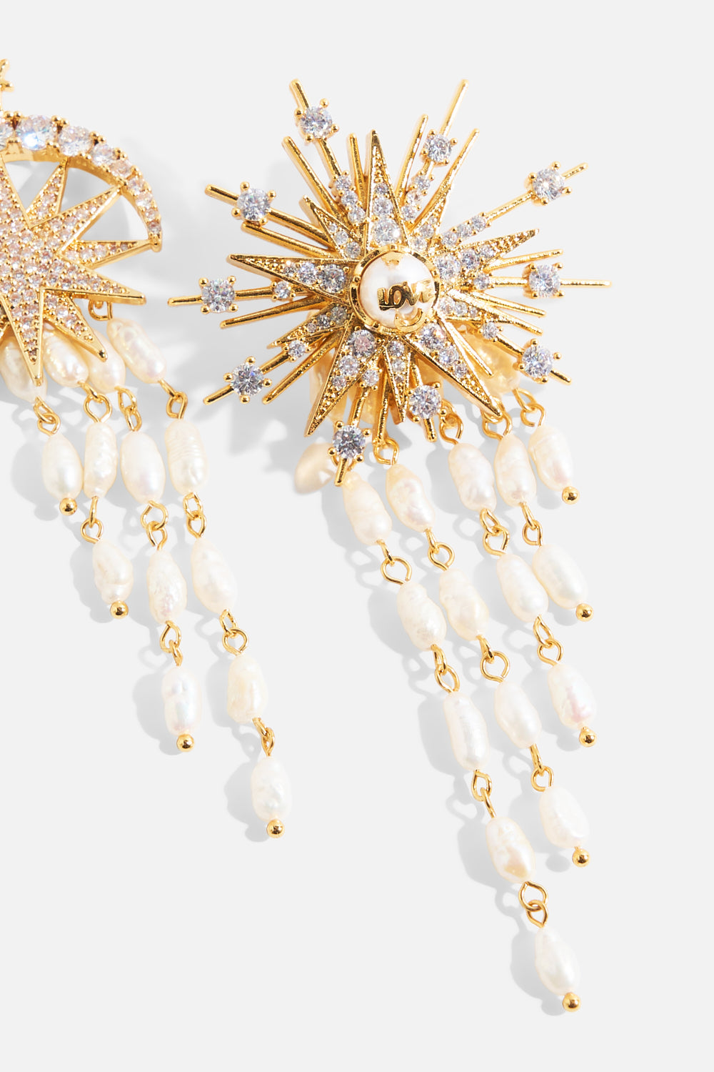 The CAMILLA Empress of Light Star Crystal Earrings in our Gold print, back view.